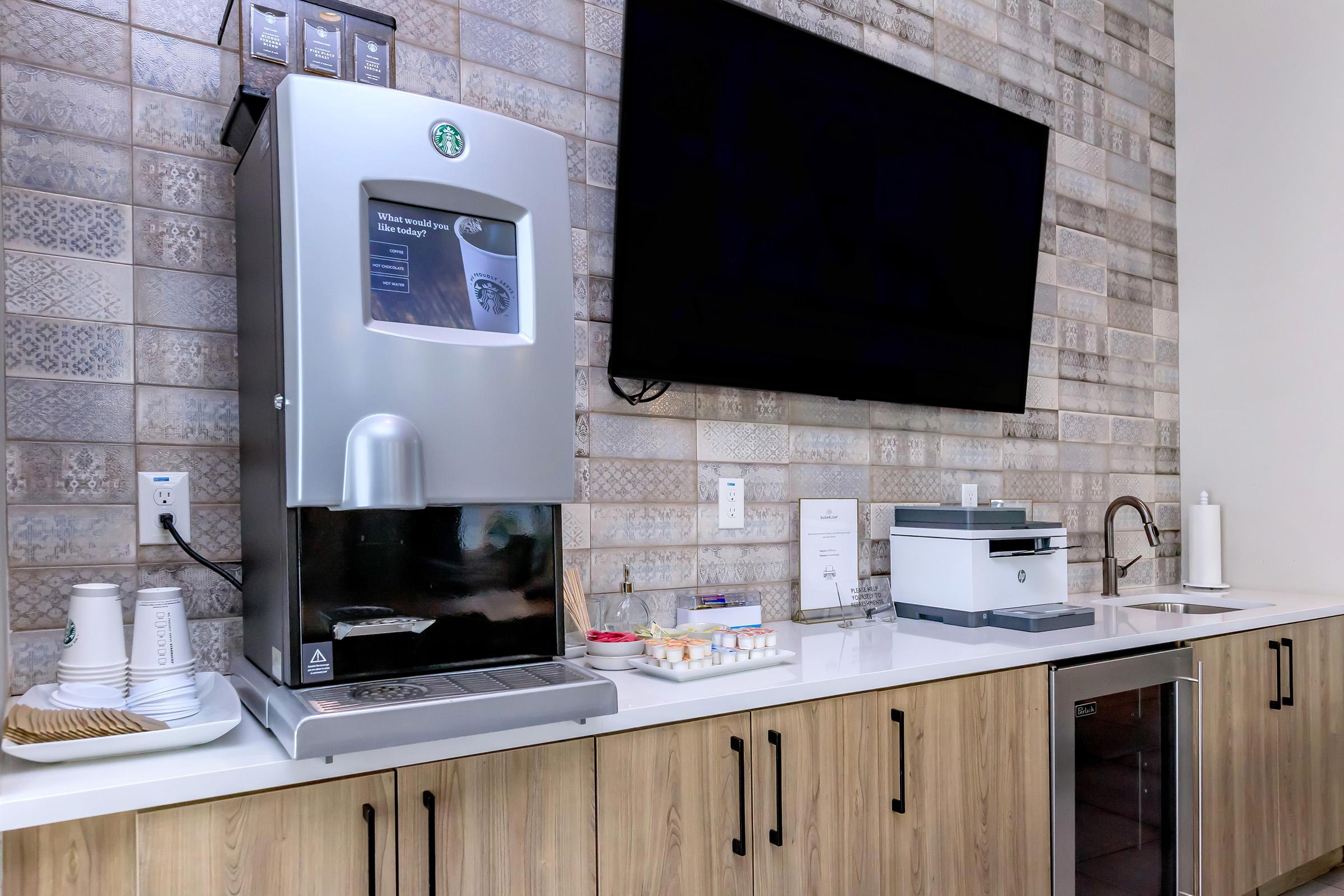 a kitchen with a sink and a microwave