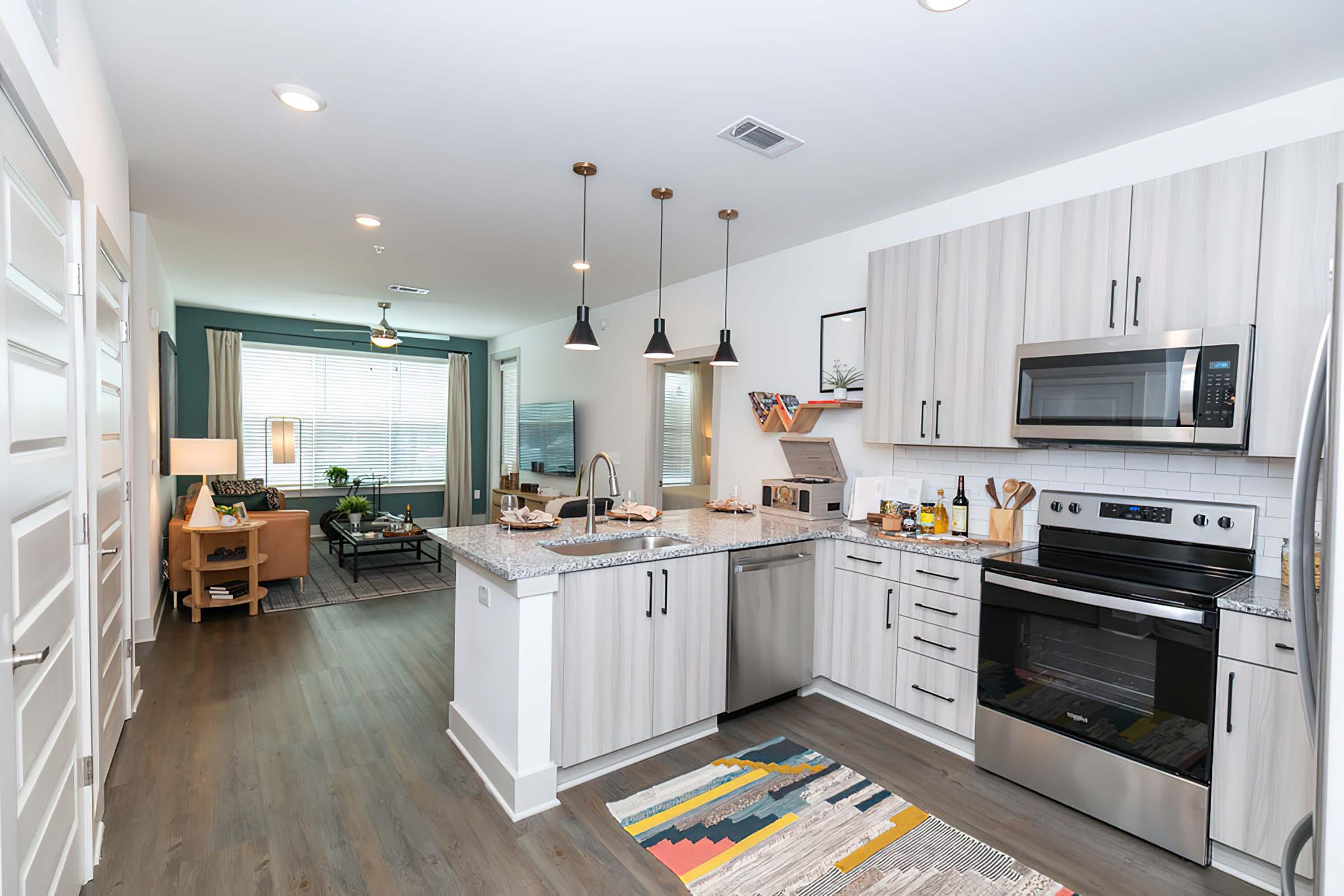 a kitchen with an island in the middle of a room