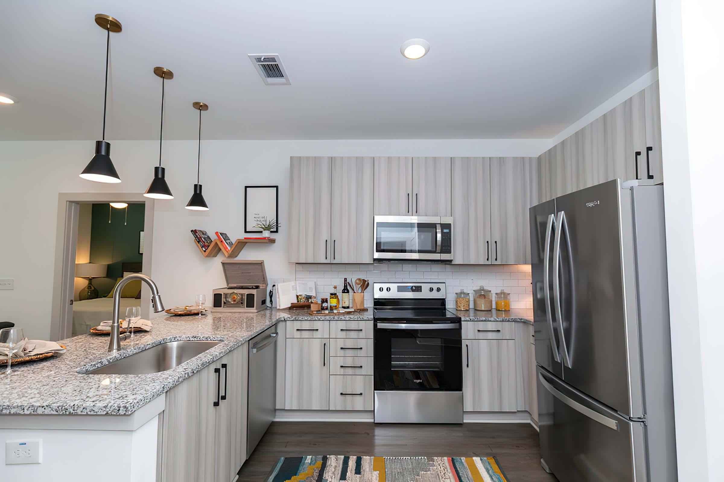 a modern kitchen with stainless steel appliances