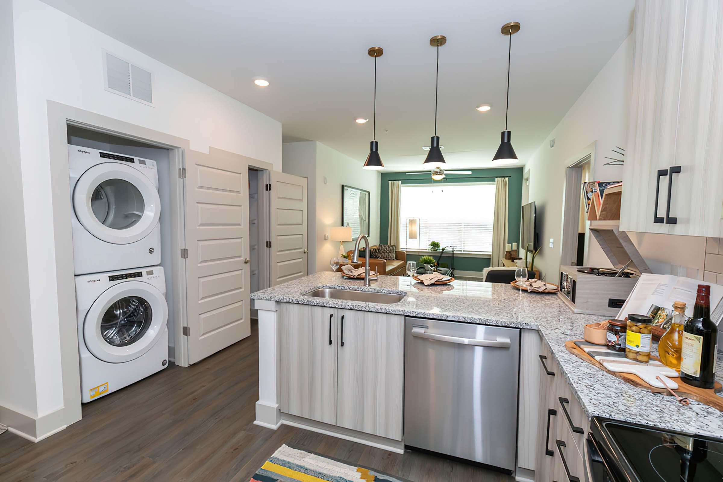 a kitchen with a sink and a microwave