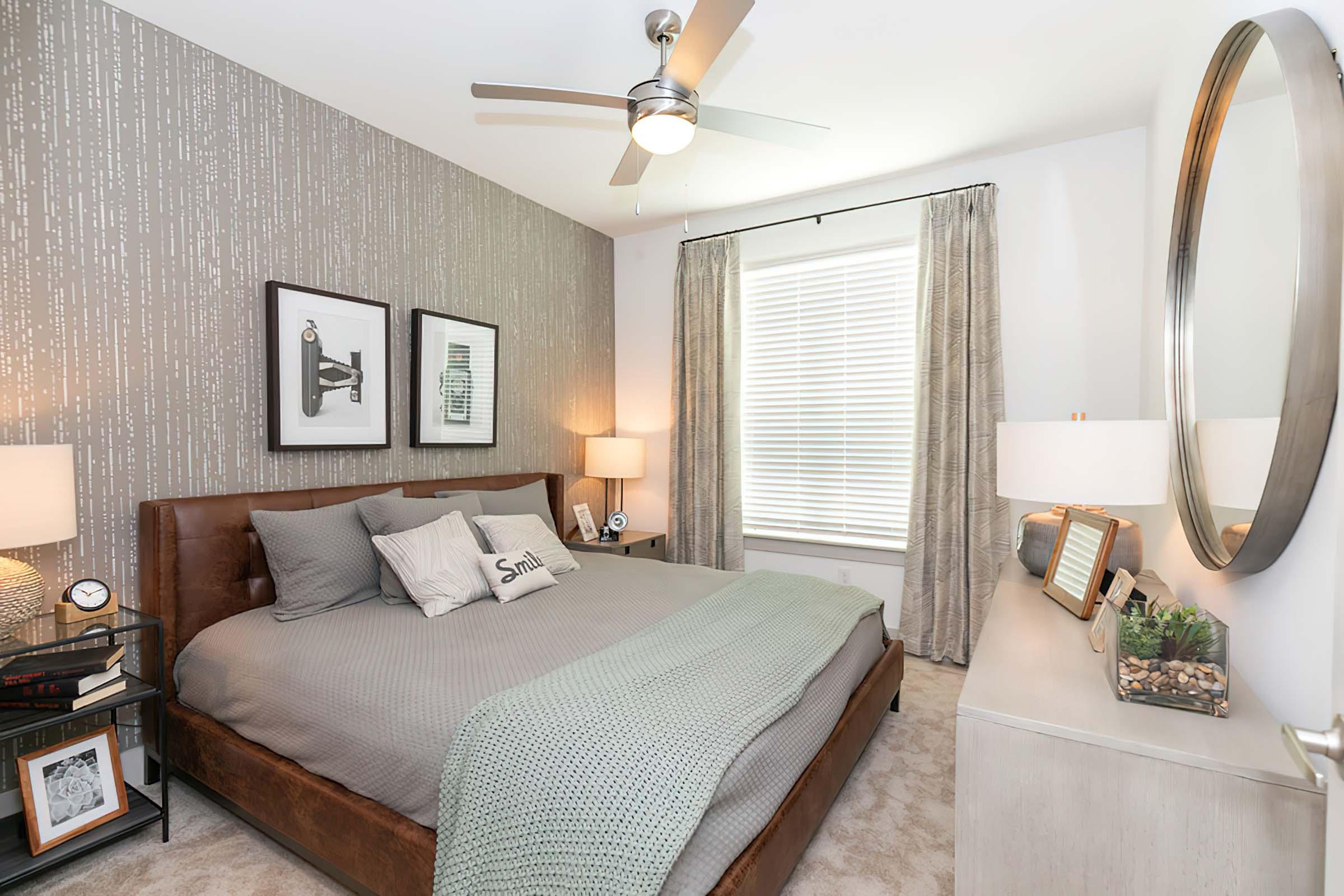 a bedroom with a large bed in a hotel room