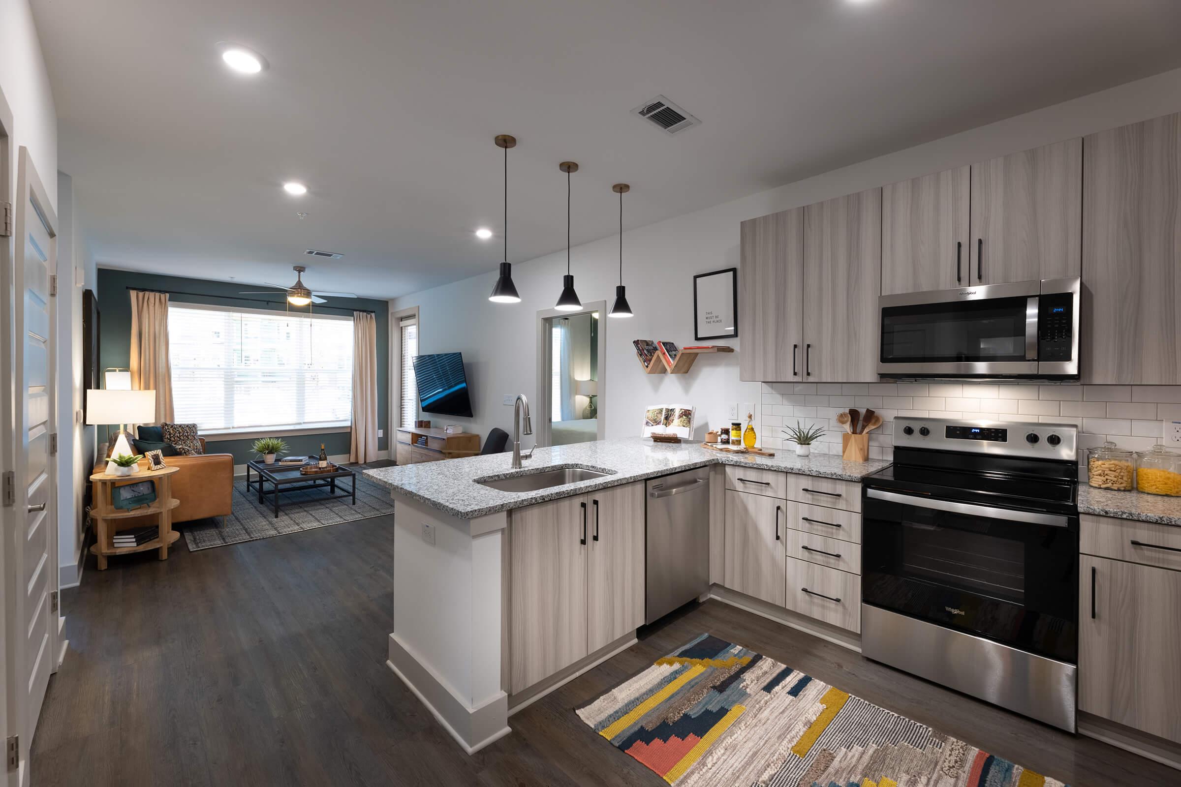 a large kitchen with stainless steel appliances