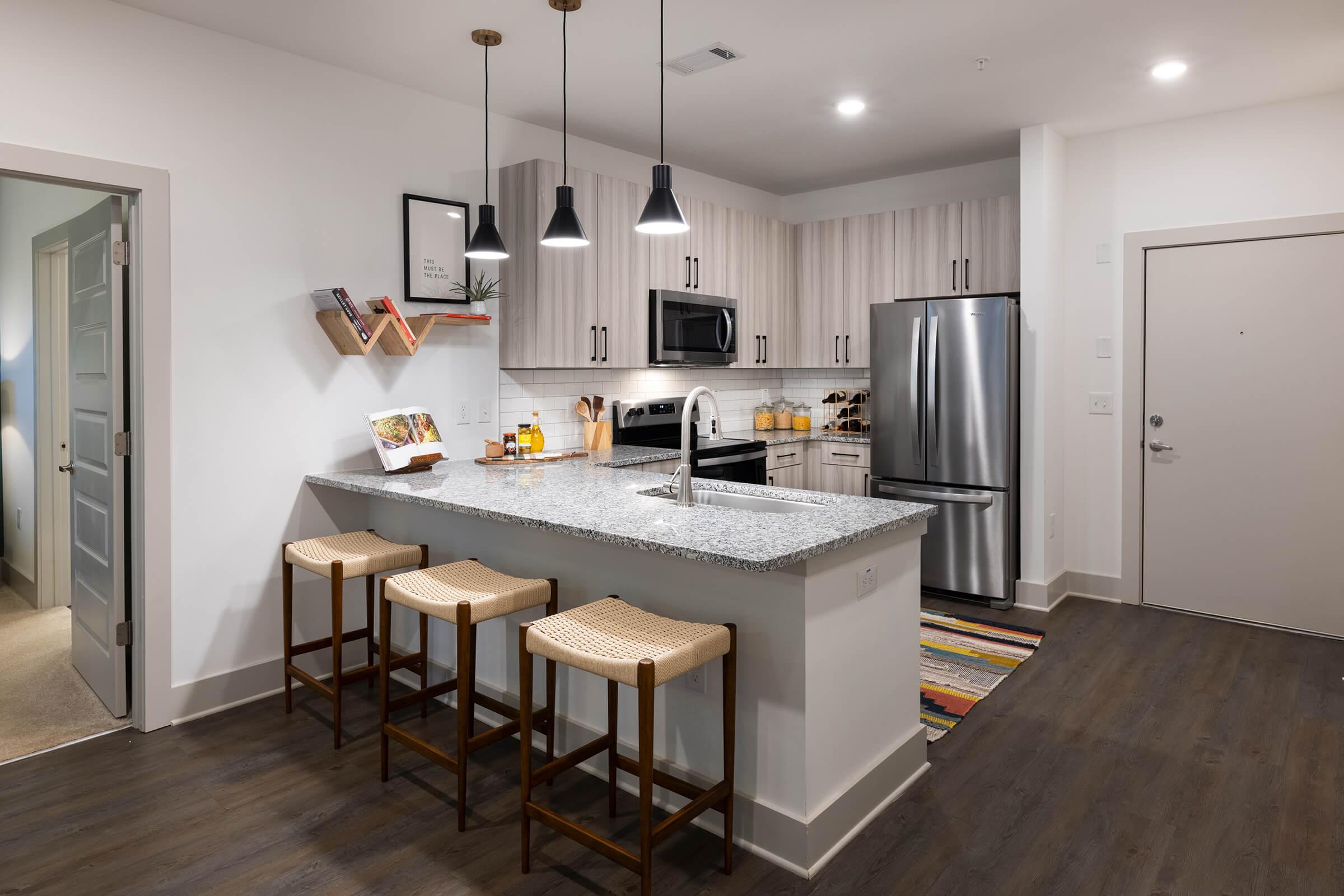 a modern kitchen with stainless steel appliances