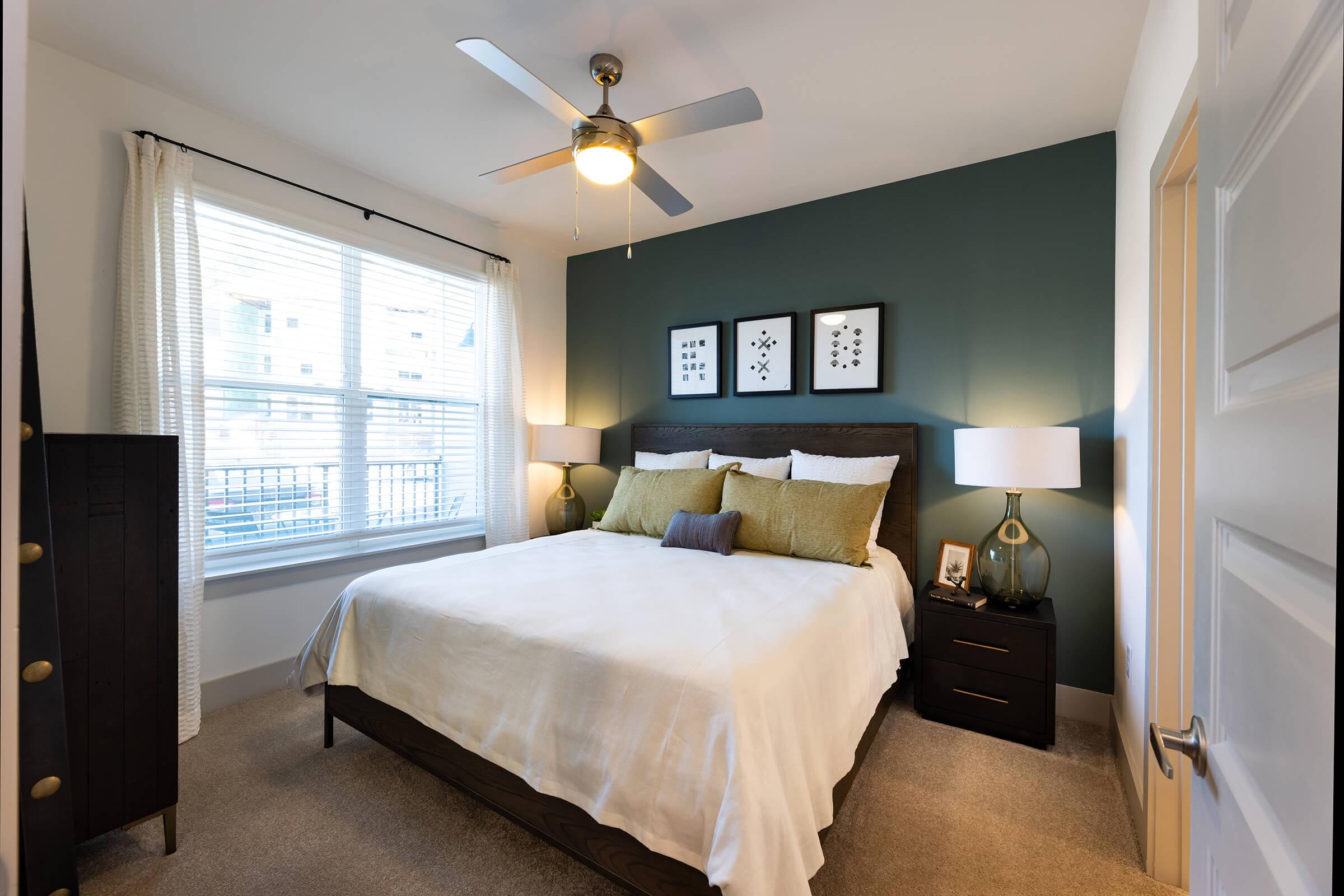 a bedroom with a large bed in a hotel room