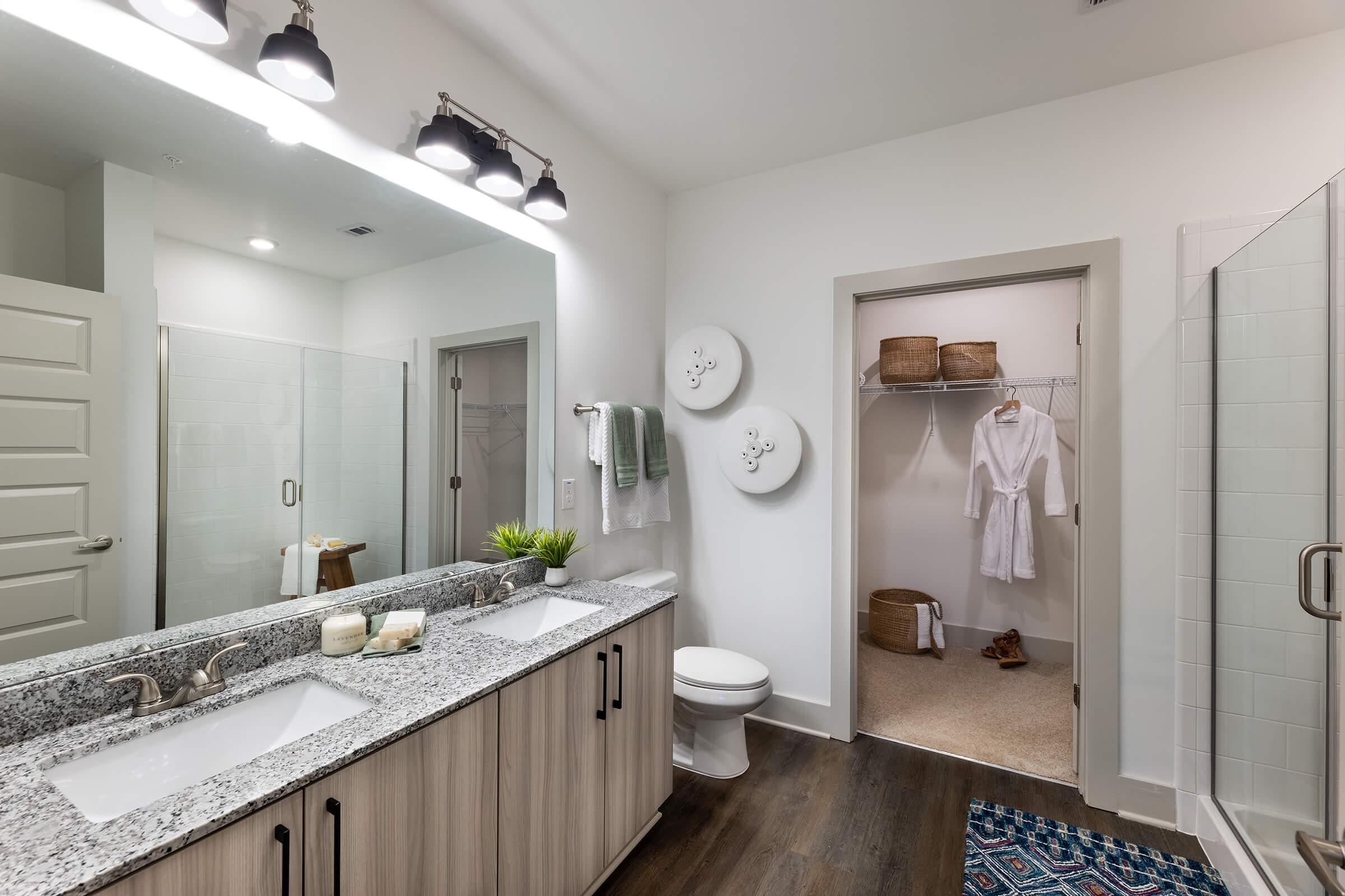 a kitchen with a sink and a mirror