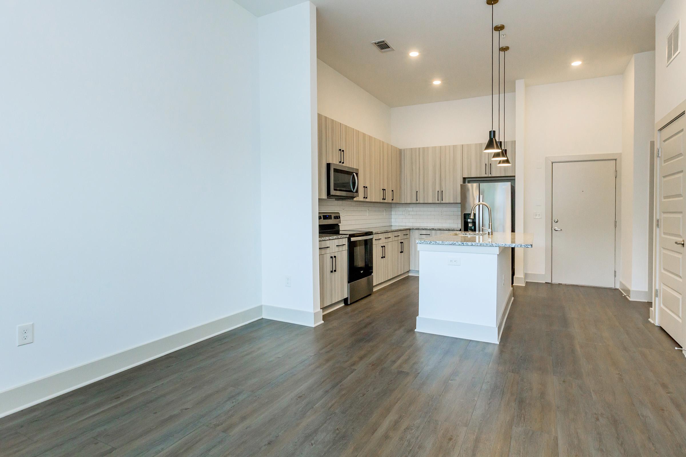 a kitchen with a wood floor