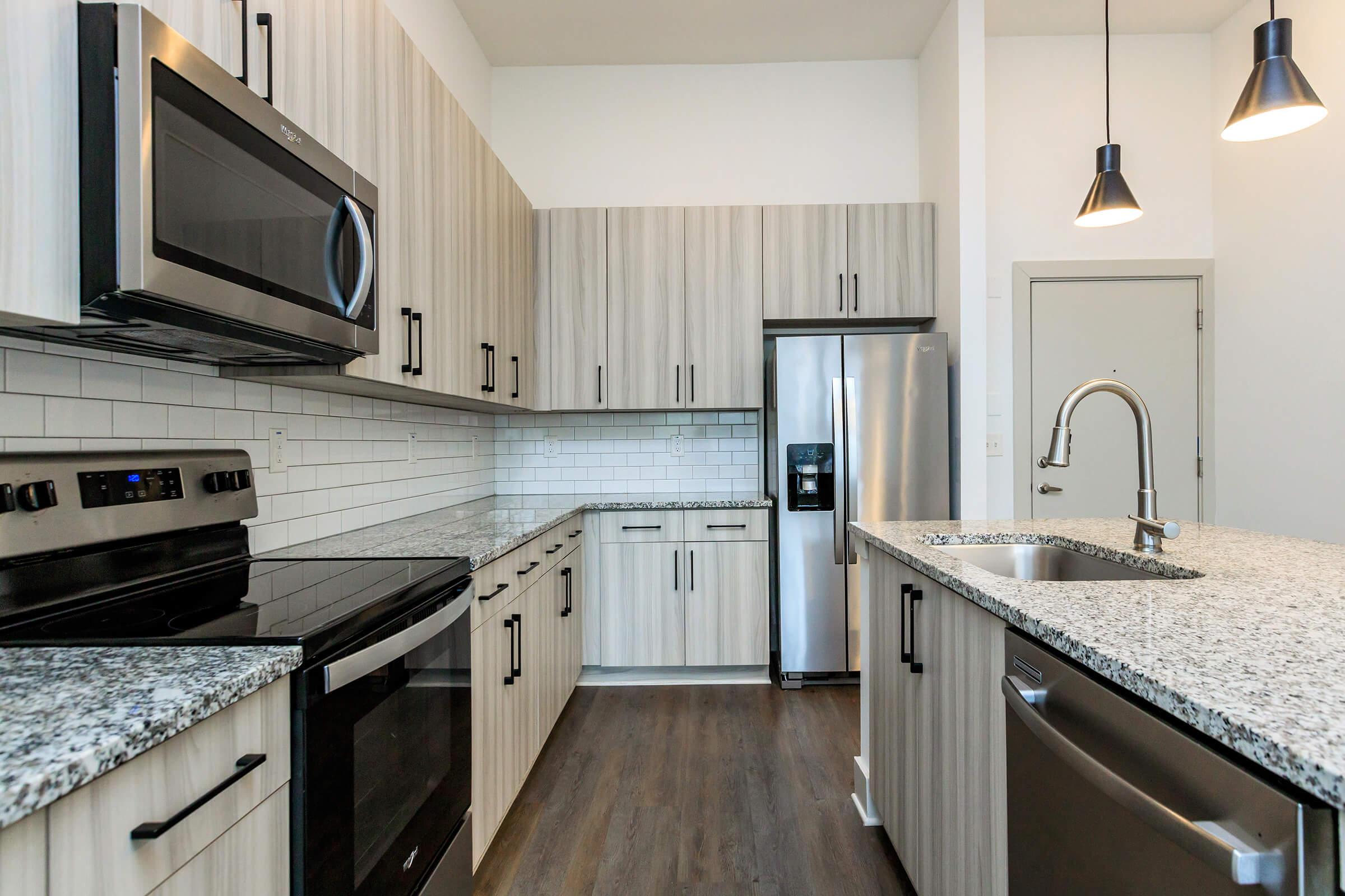 a modern kitchen with stainless steel appliances