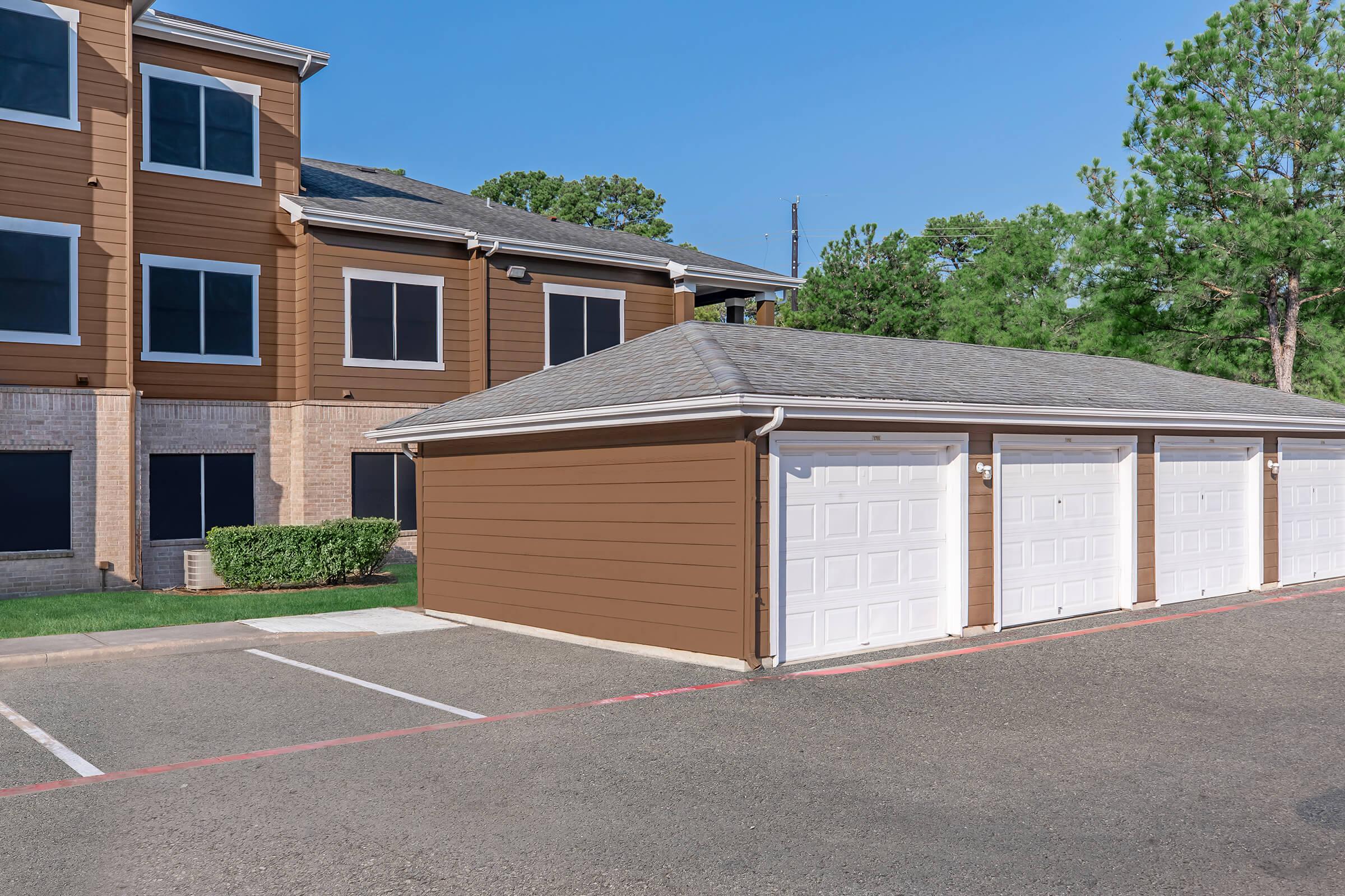 an empty parking lot in front of a house