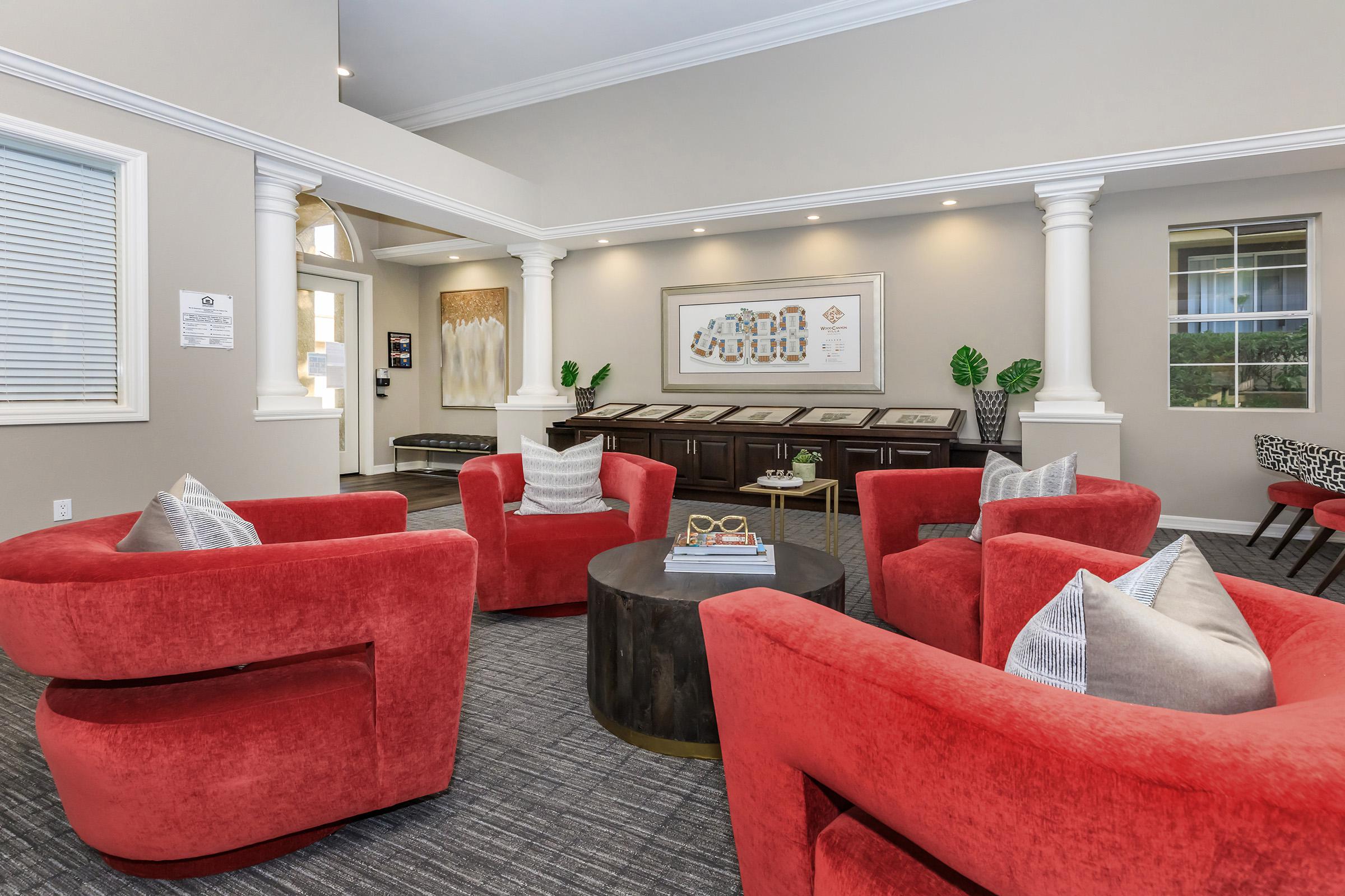 a living room filled with furniture and a flat screen tv