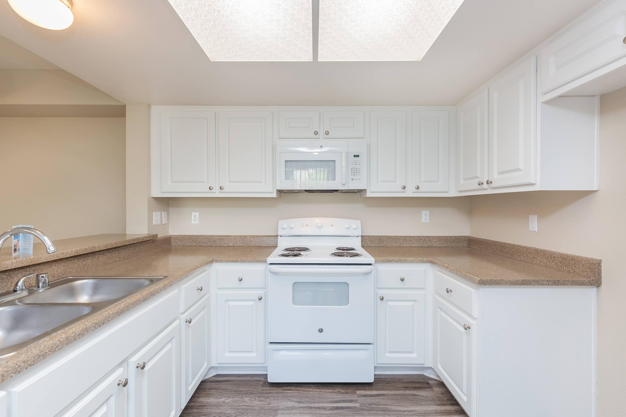 a kitchen with a stove top oven