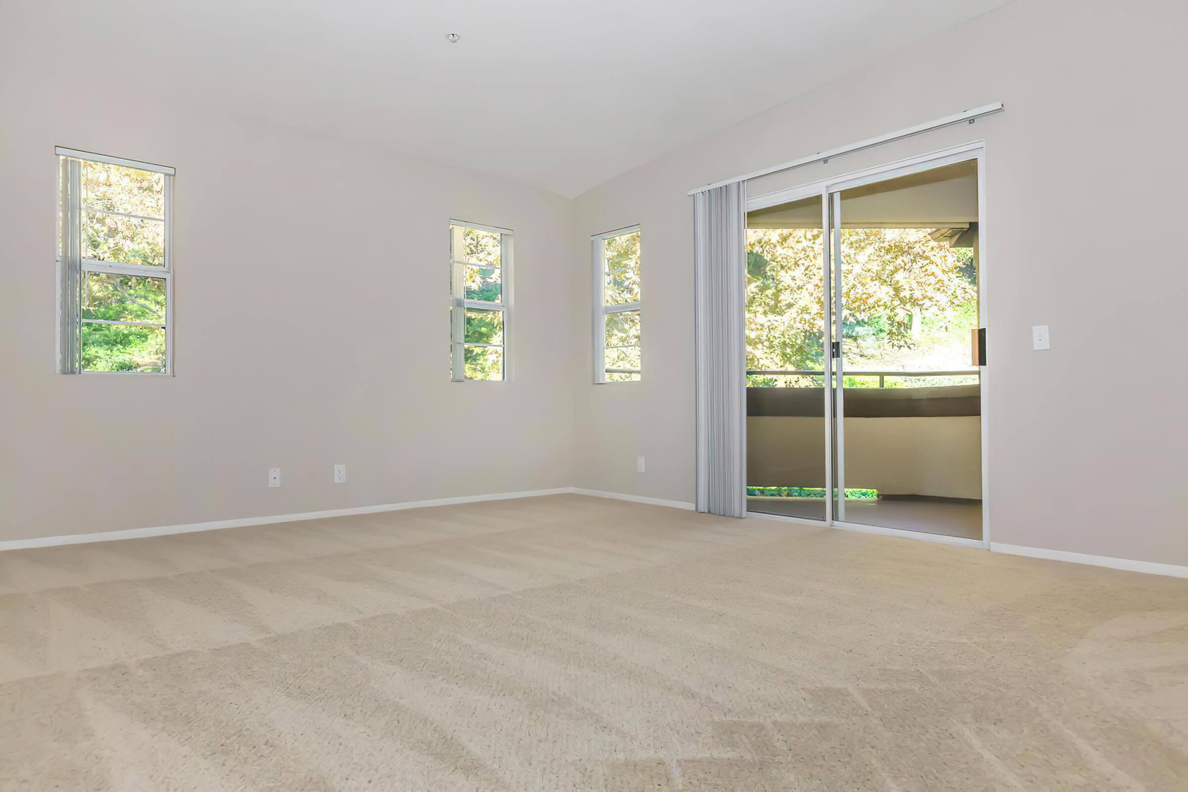 Vacant living room with sliding glass doors