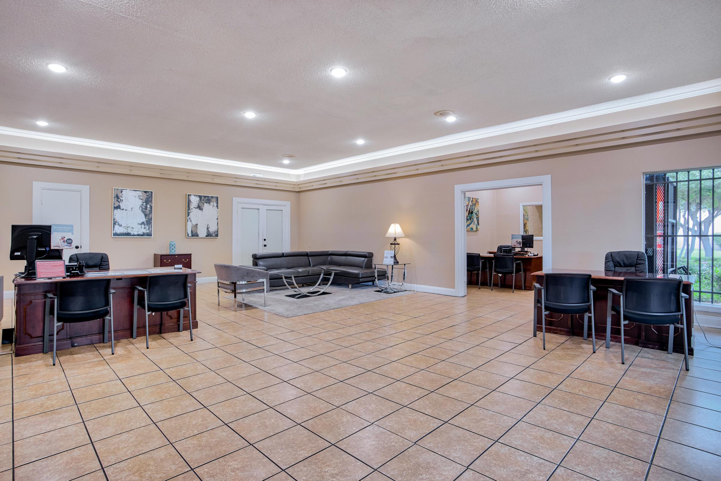 a room filled with furniture and a large window