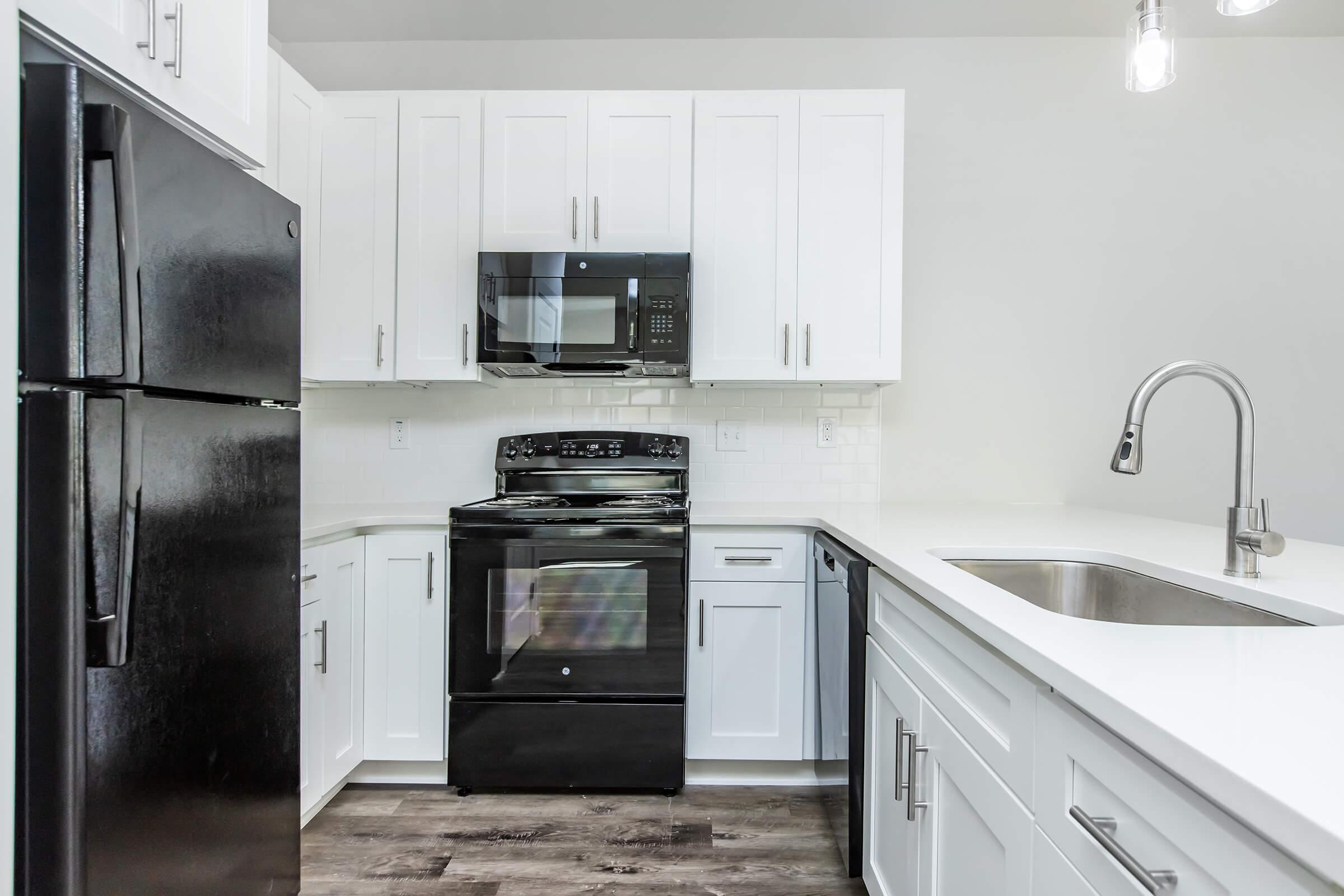 a kitchen with a stove and a refrigerator