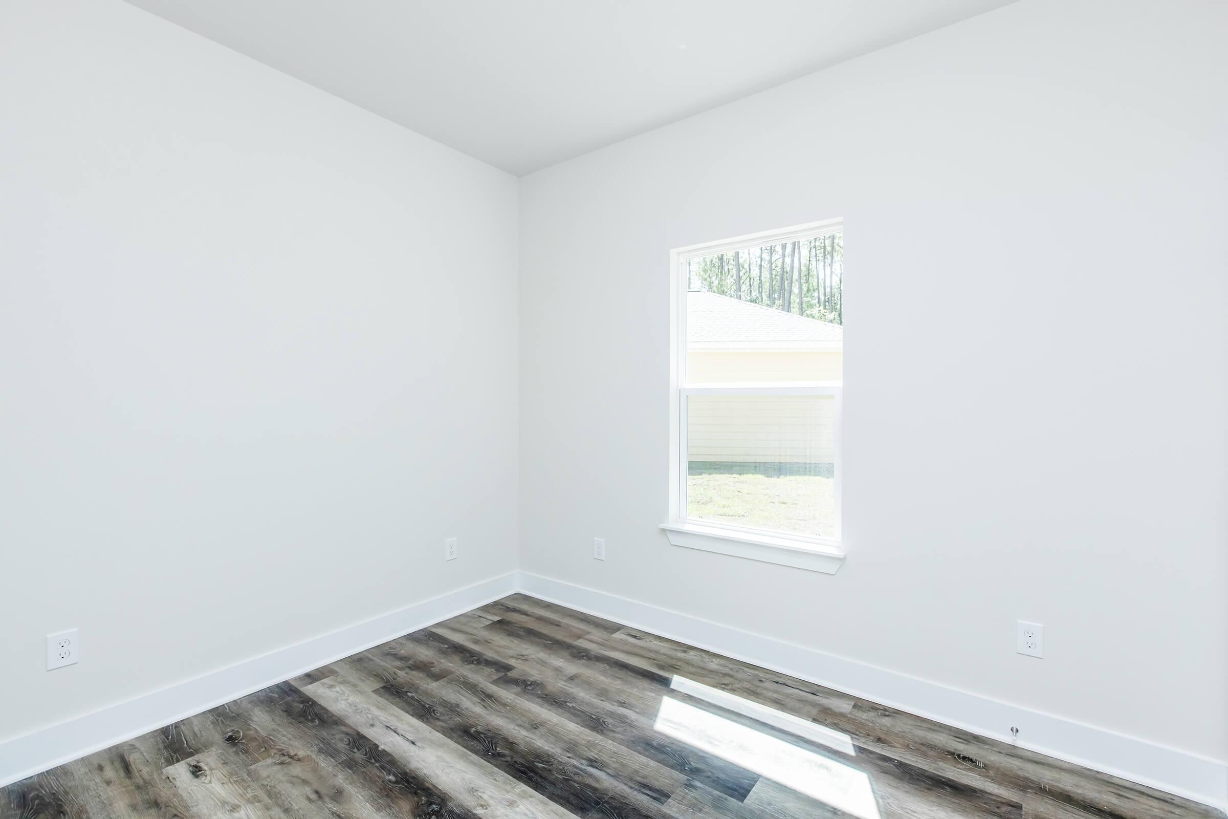 a room with a sink and a window