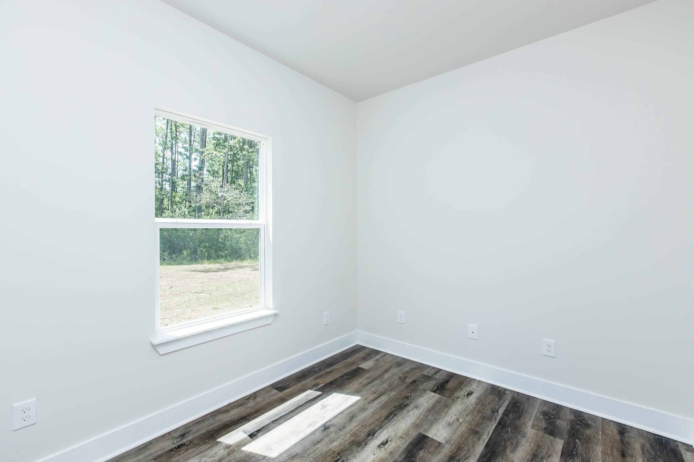 a room with a sink and a window