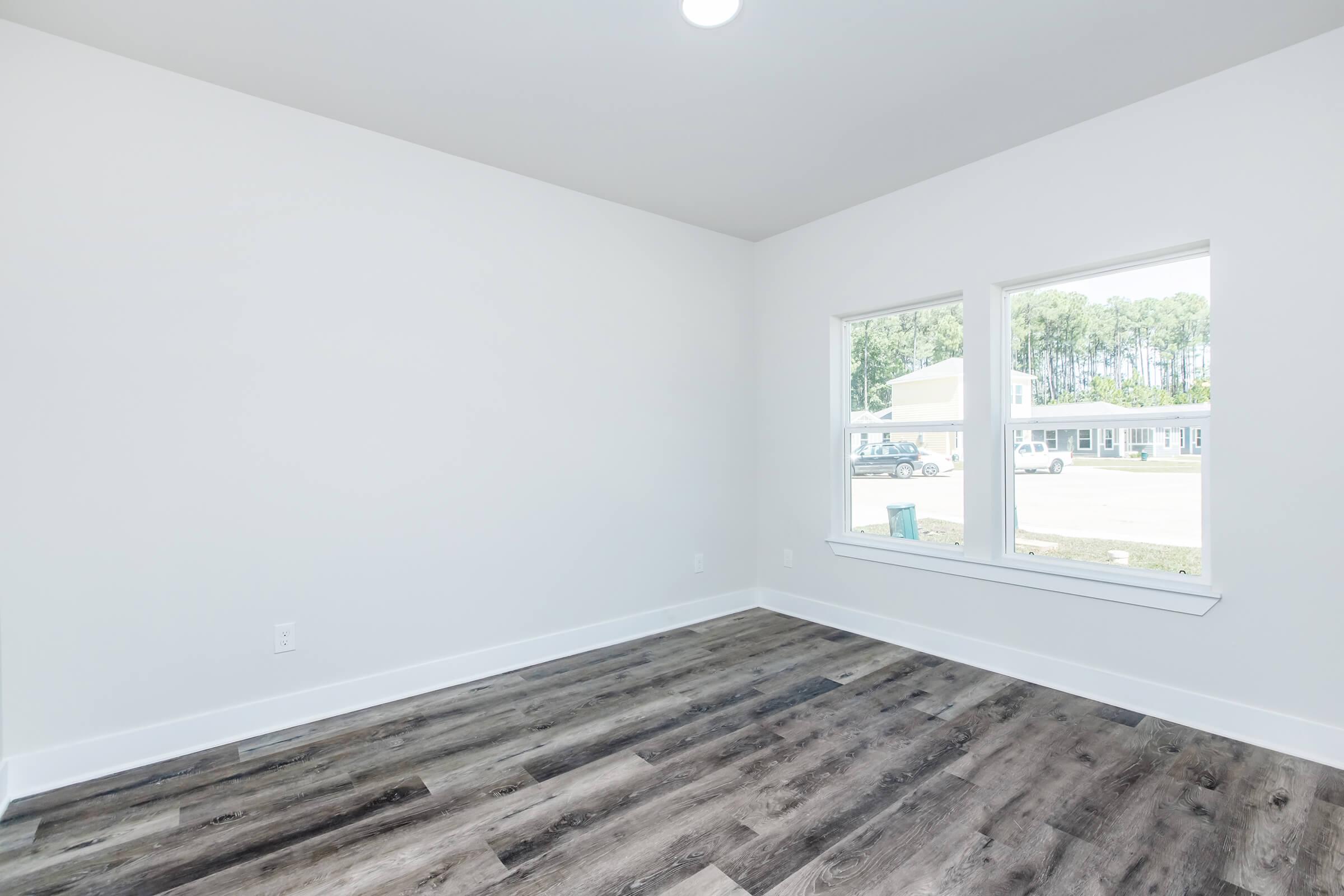 a bedroom with a large window