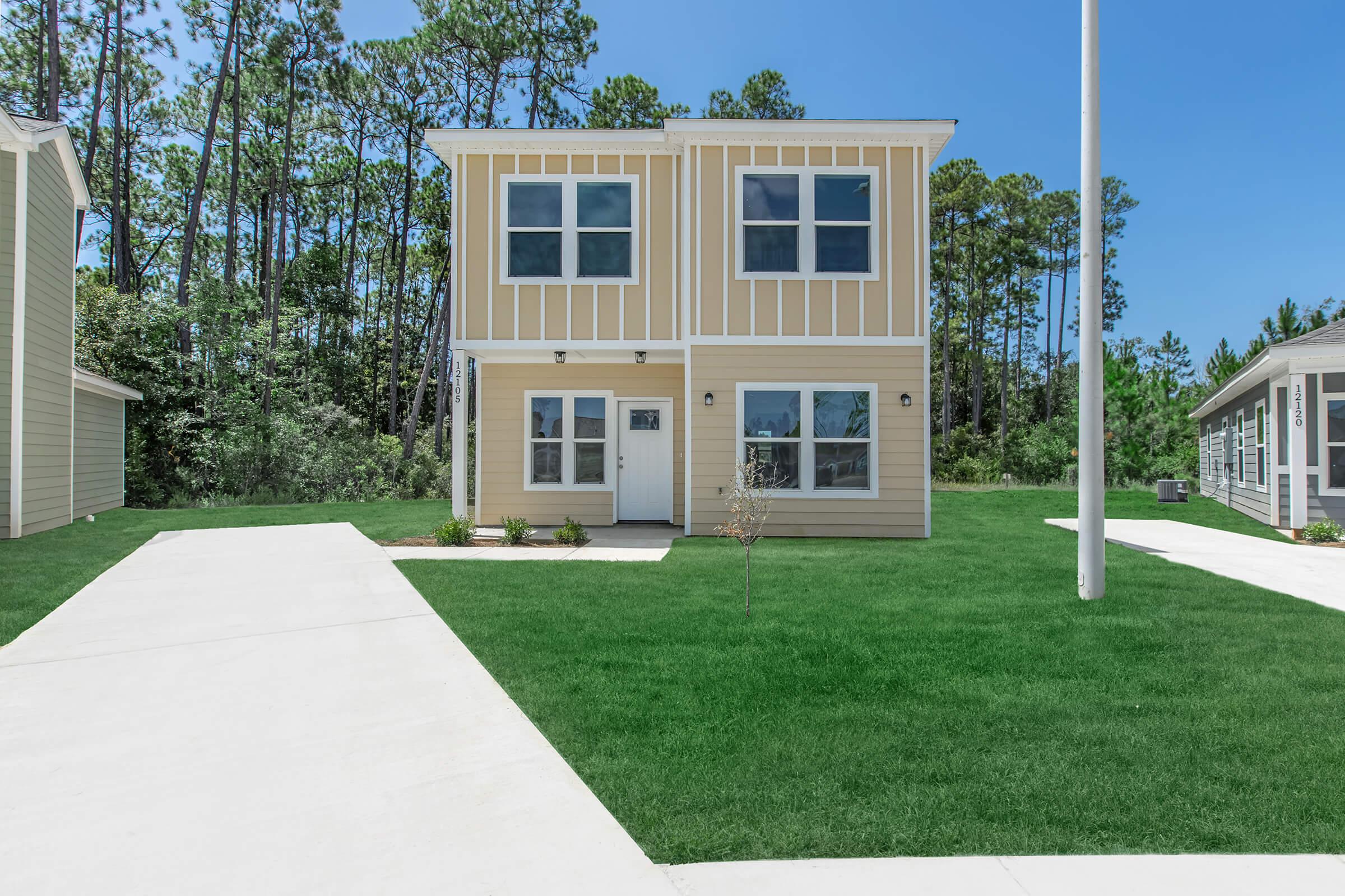 a large lawn in front of a house