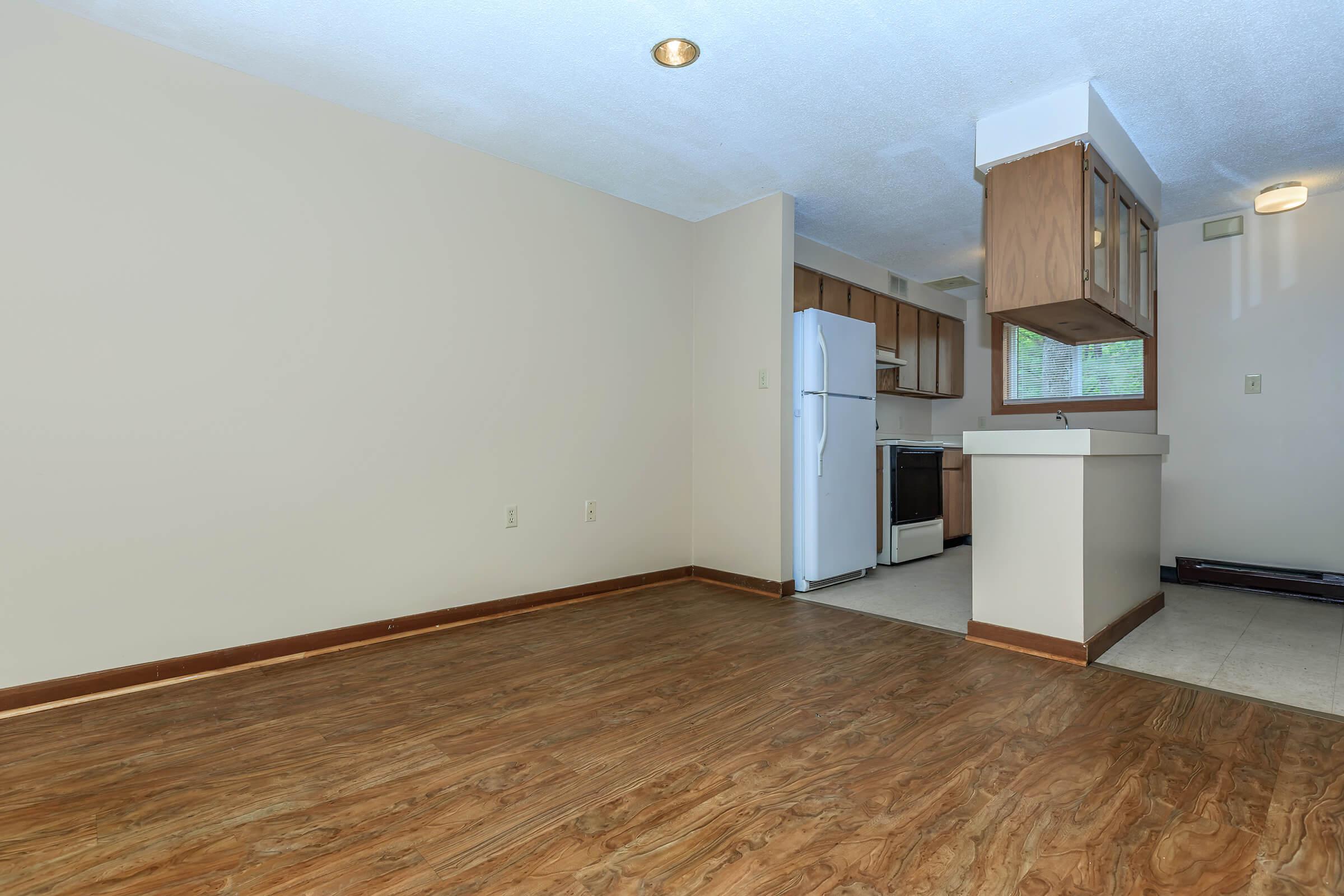 a large empty room with a wooden floor