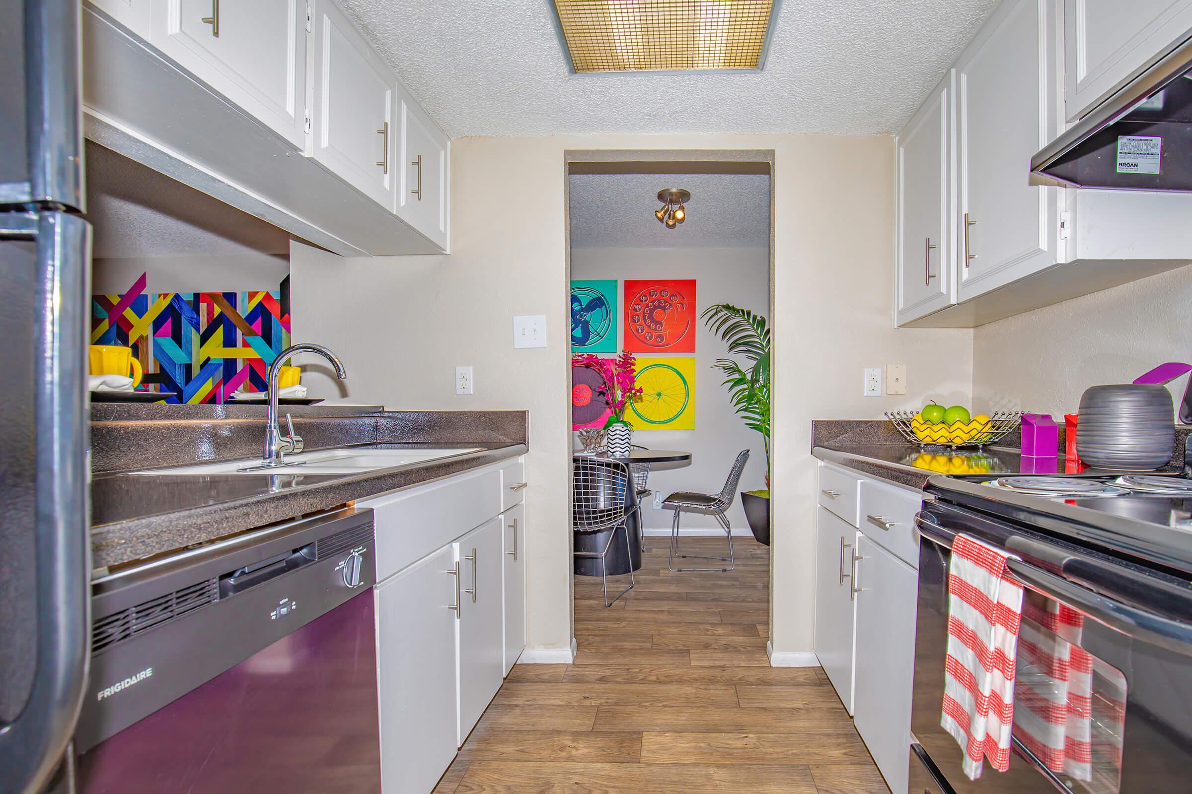 a large kitchen with stainless steel appliances
