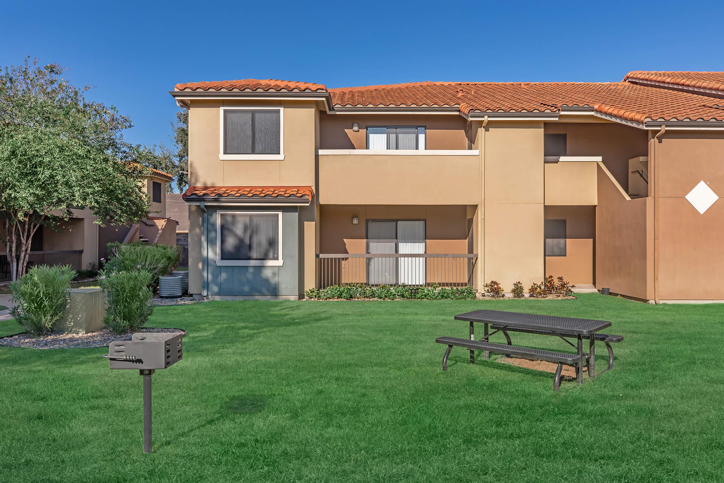 a large lawn in front of a house