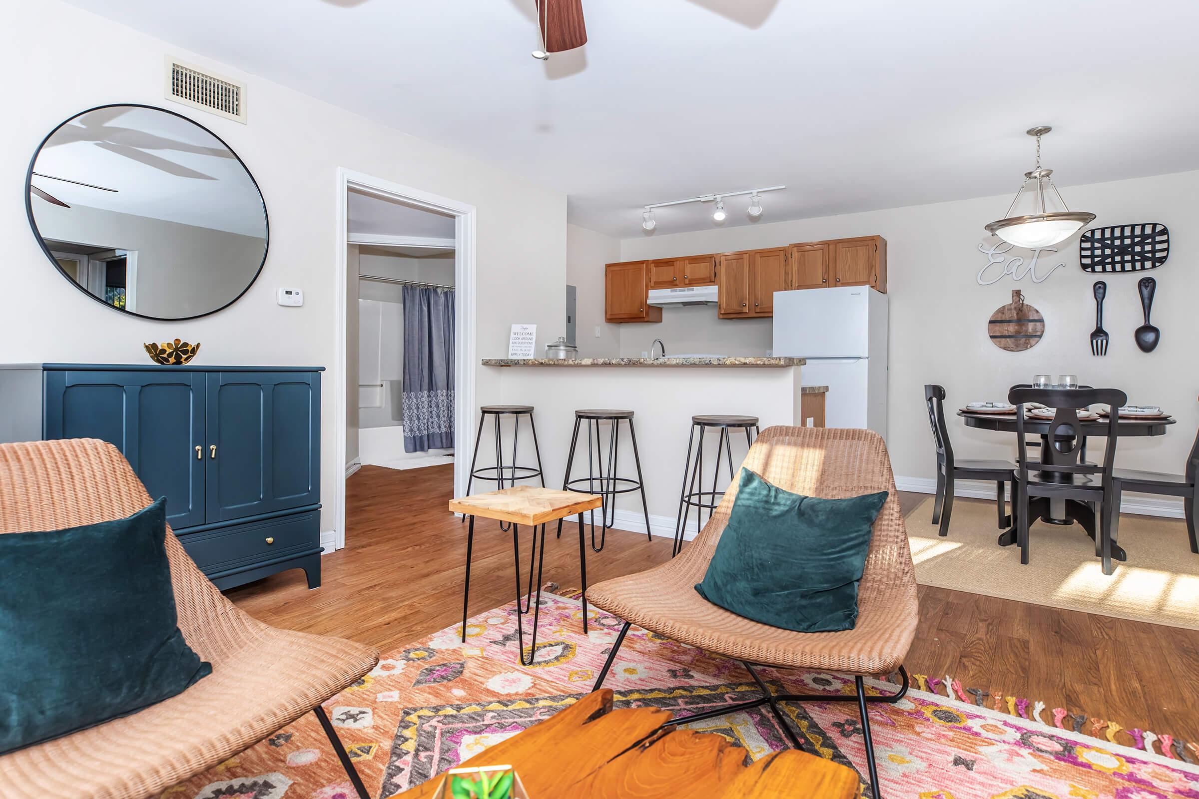 a living room filled with furniture and a table