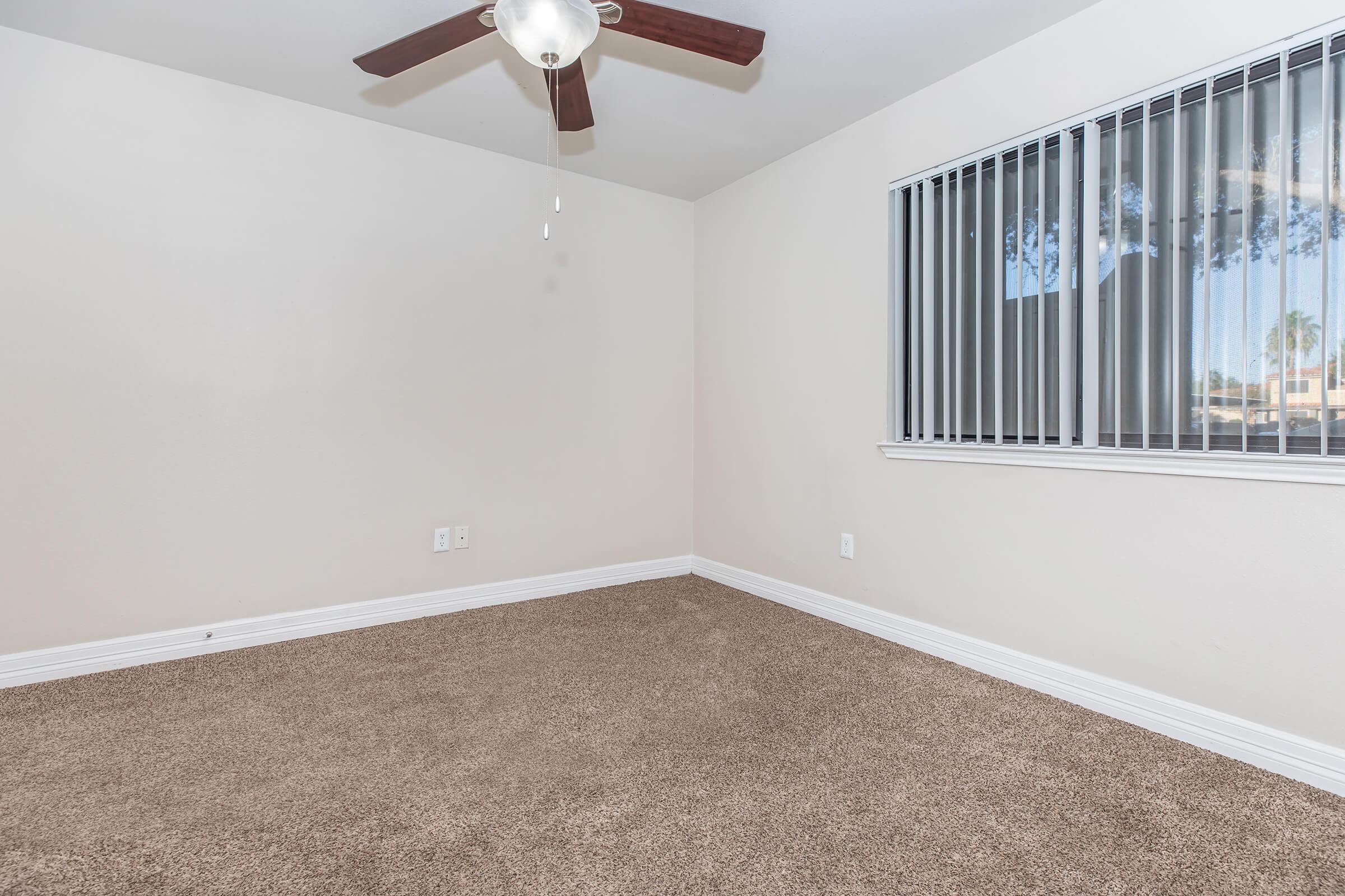 a bedroom with a large mirror