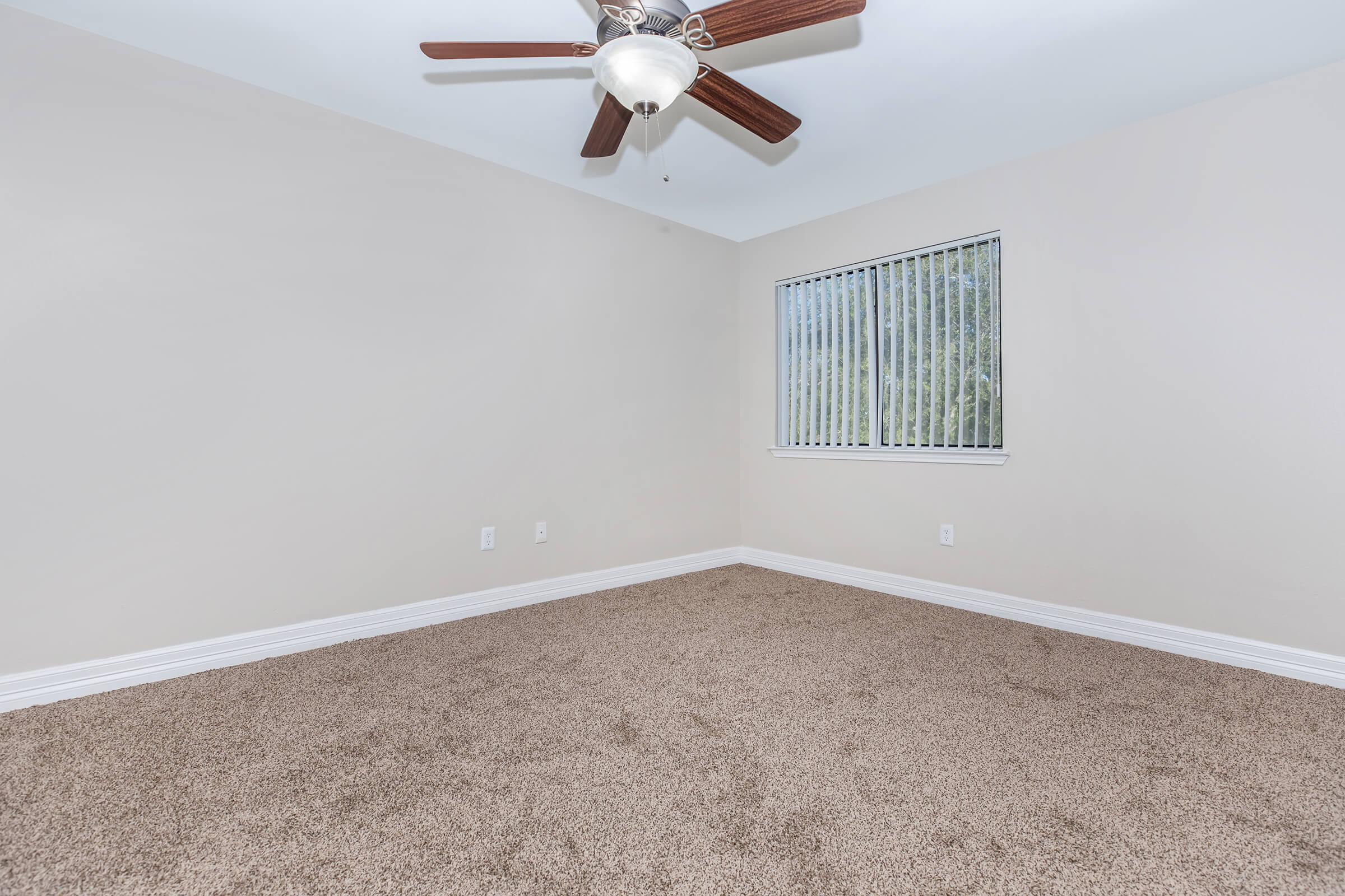 a bedroom with a large window