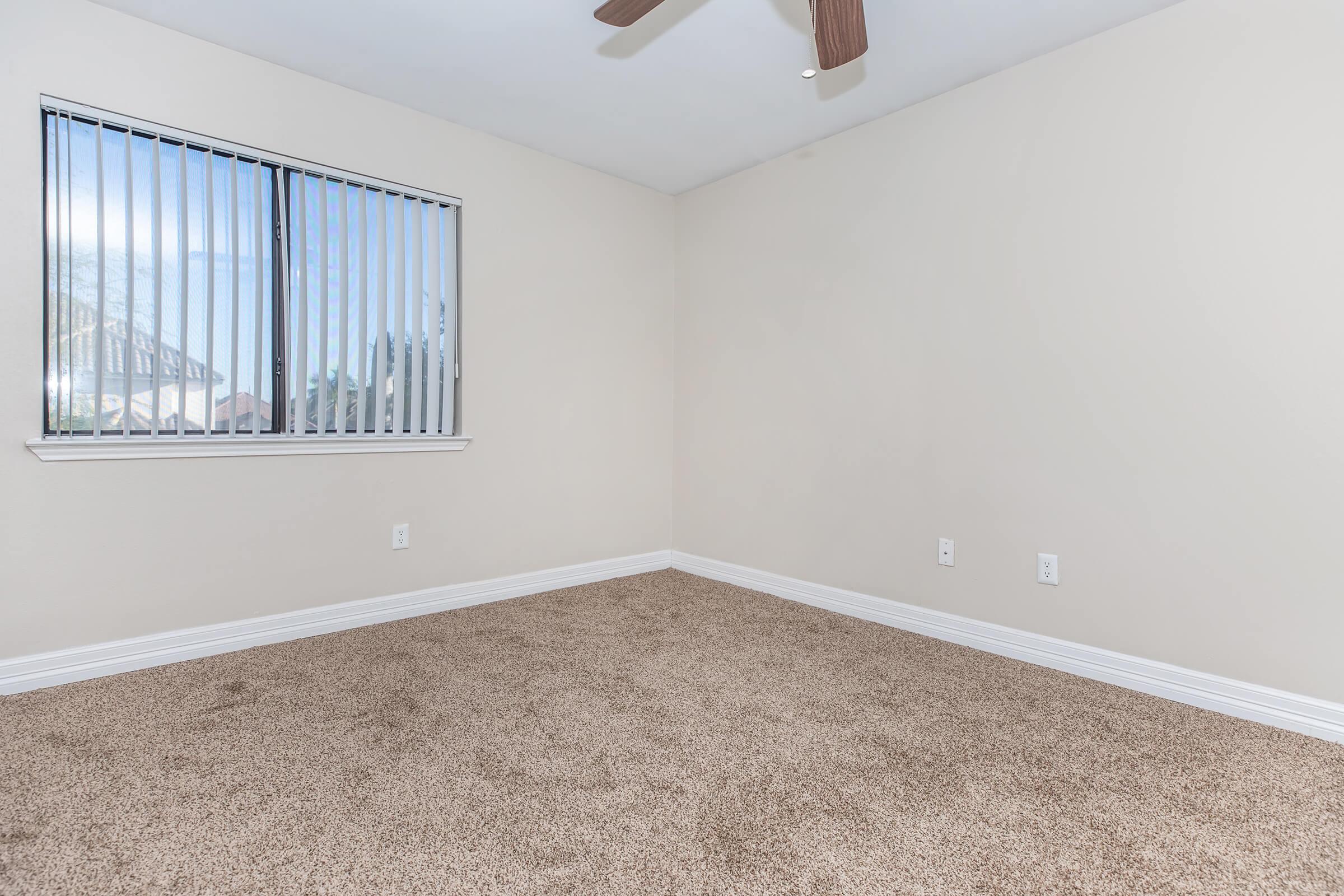 a bedroom with a large mirror