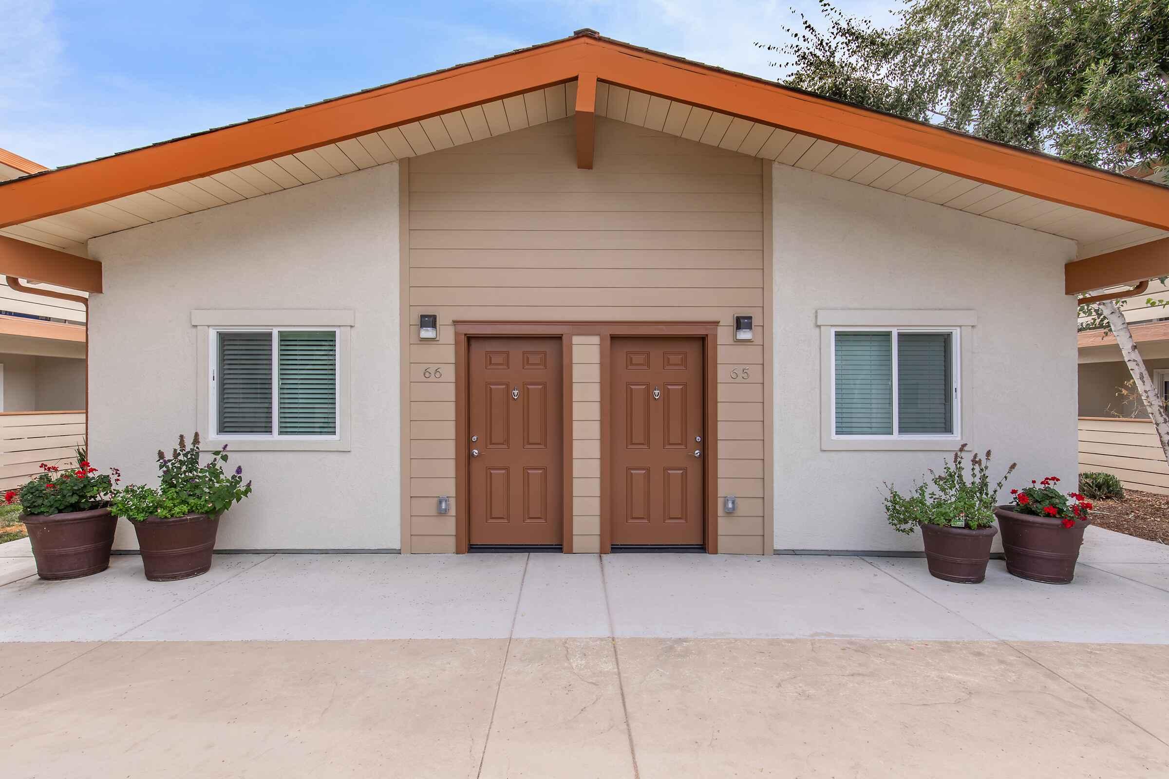 a house that is parked on the side of a building