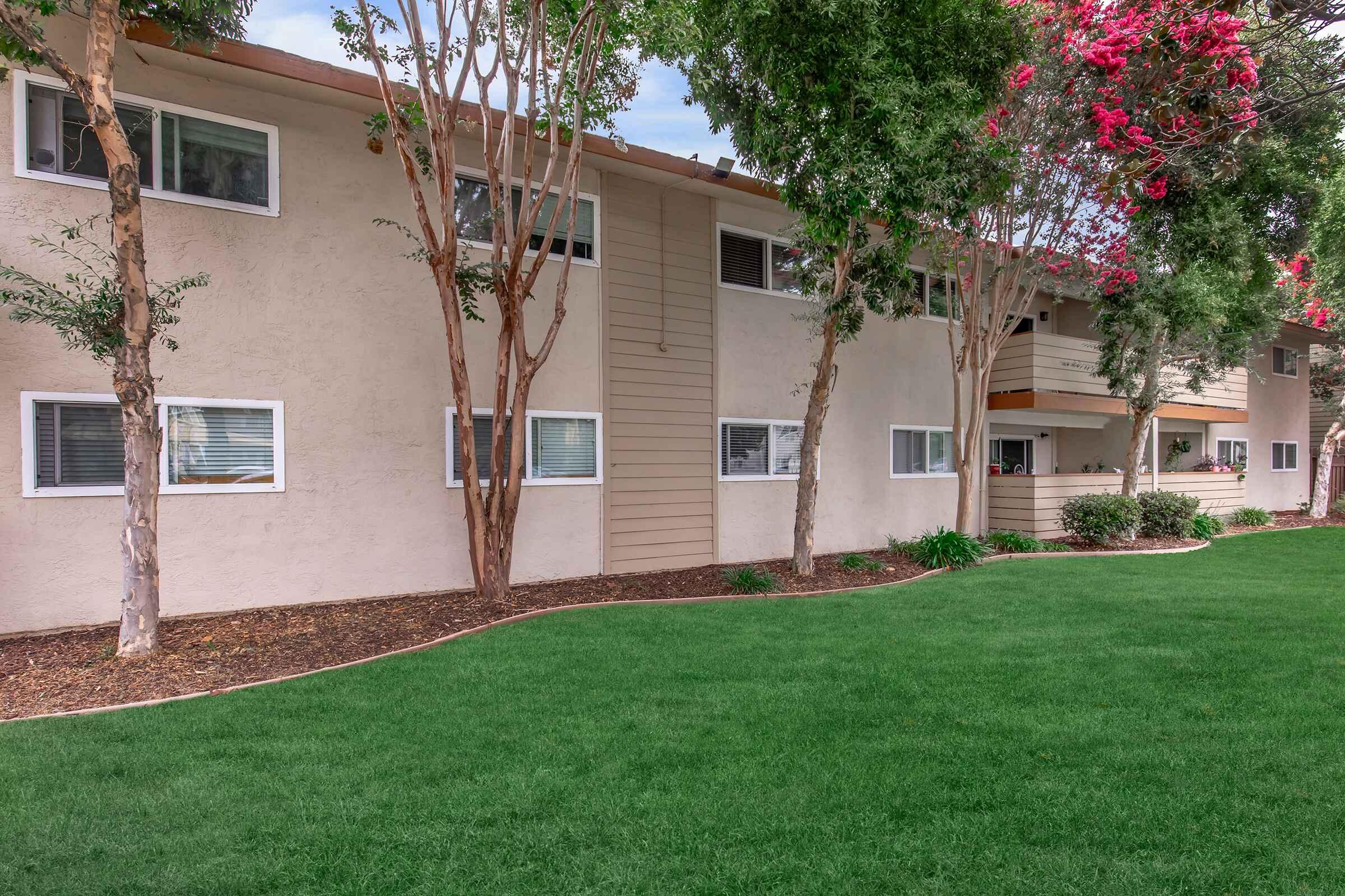 a large lawn in front of a house