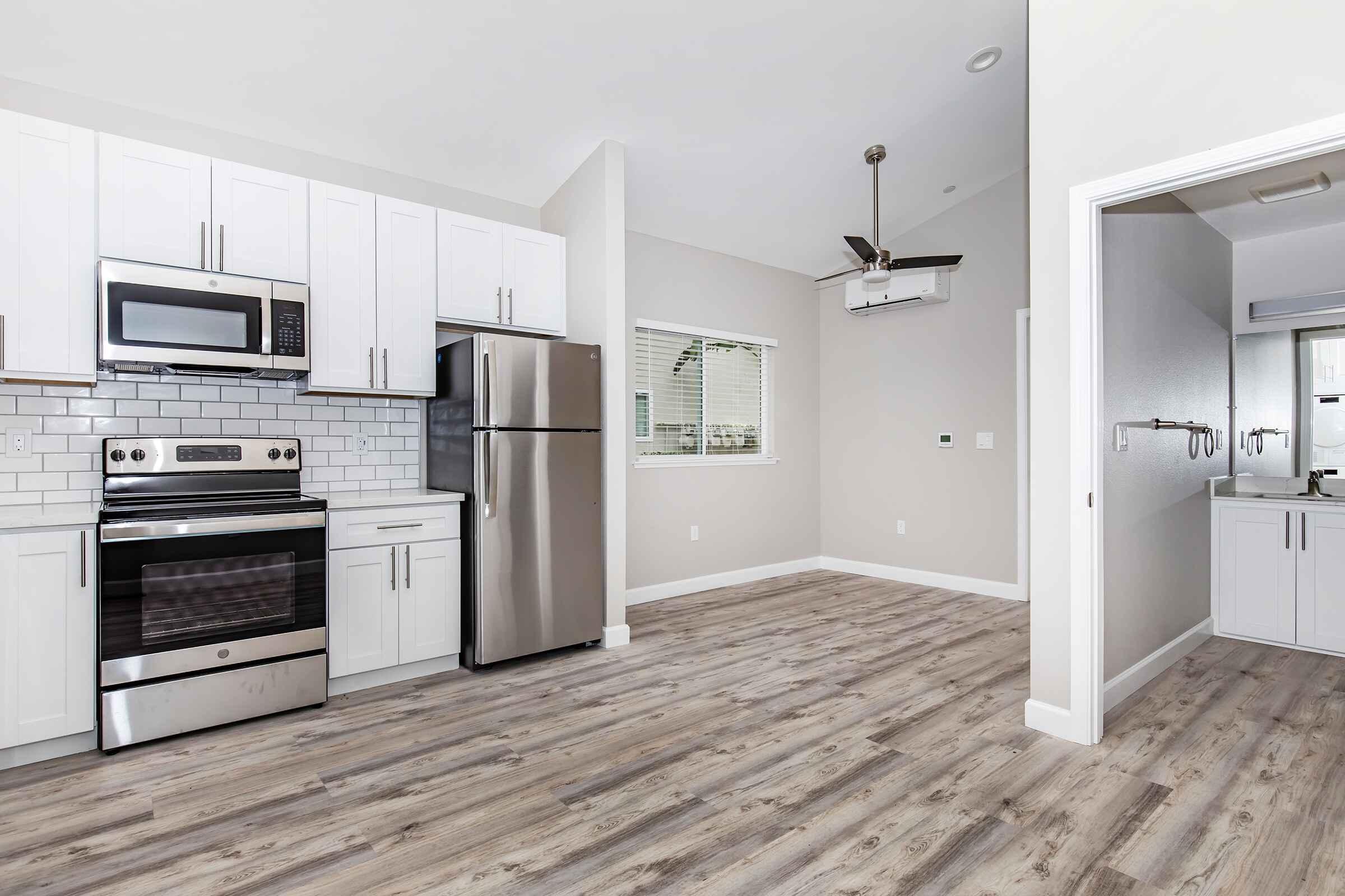 a kitchen with a sink and a refrigerator