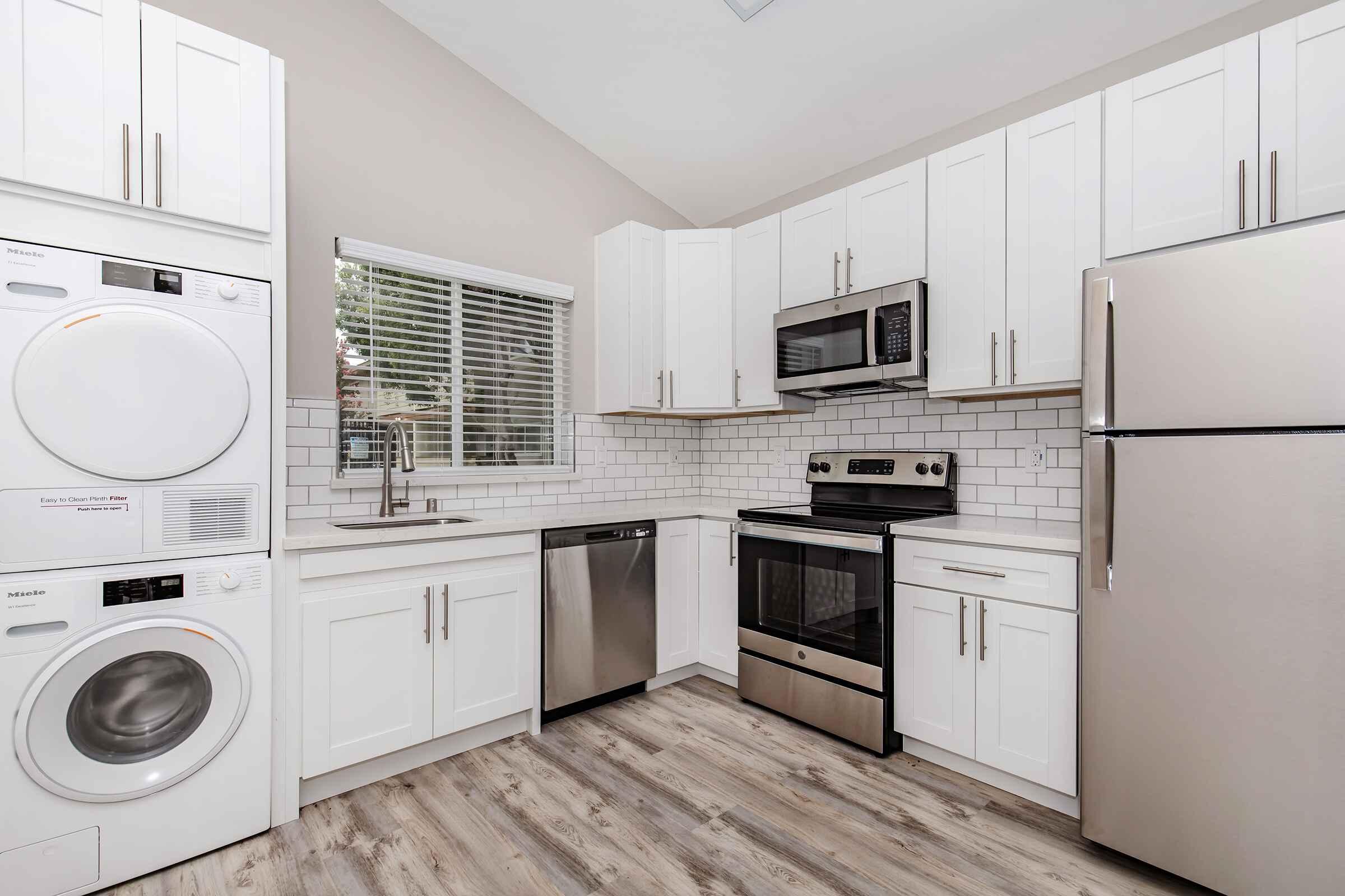 a kitchen with a stove and a refrigerator