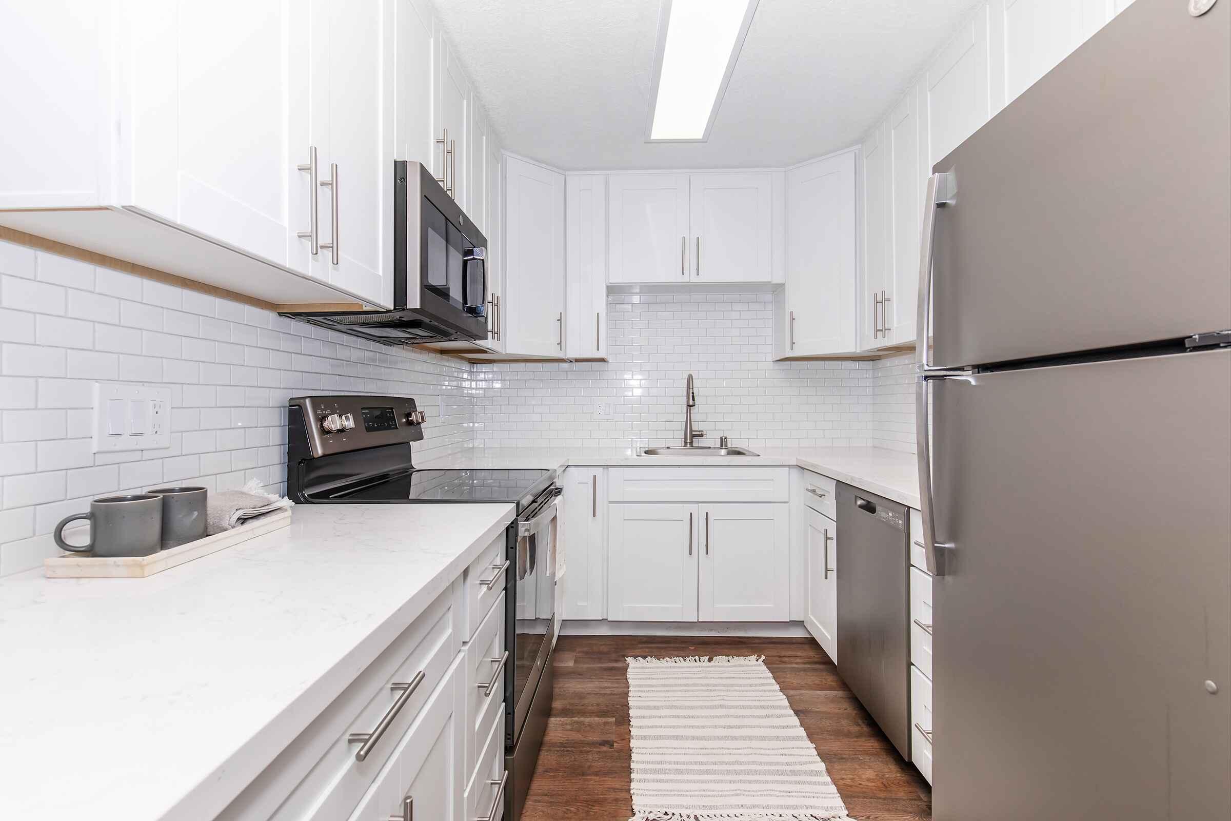 a kitchen with a stove top oven sitting inside of a building