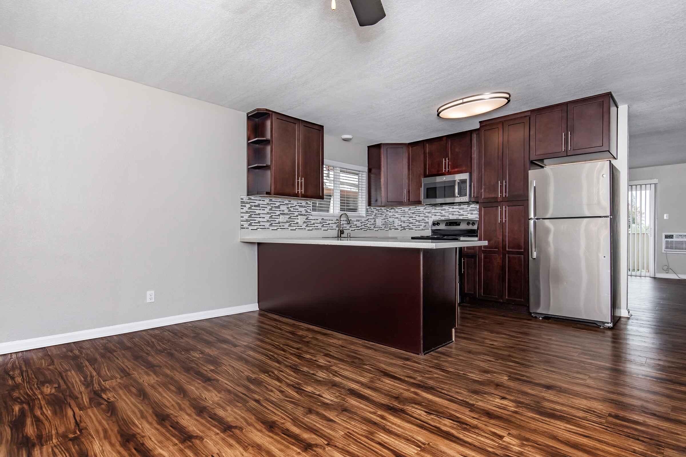 a kitchen with a wood floor