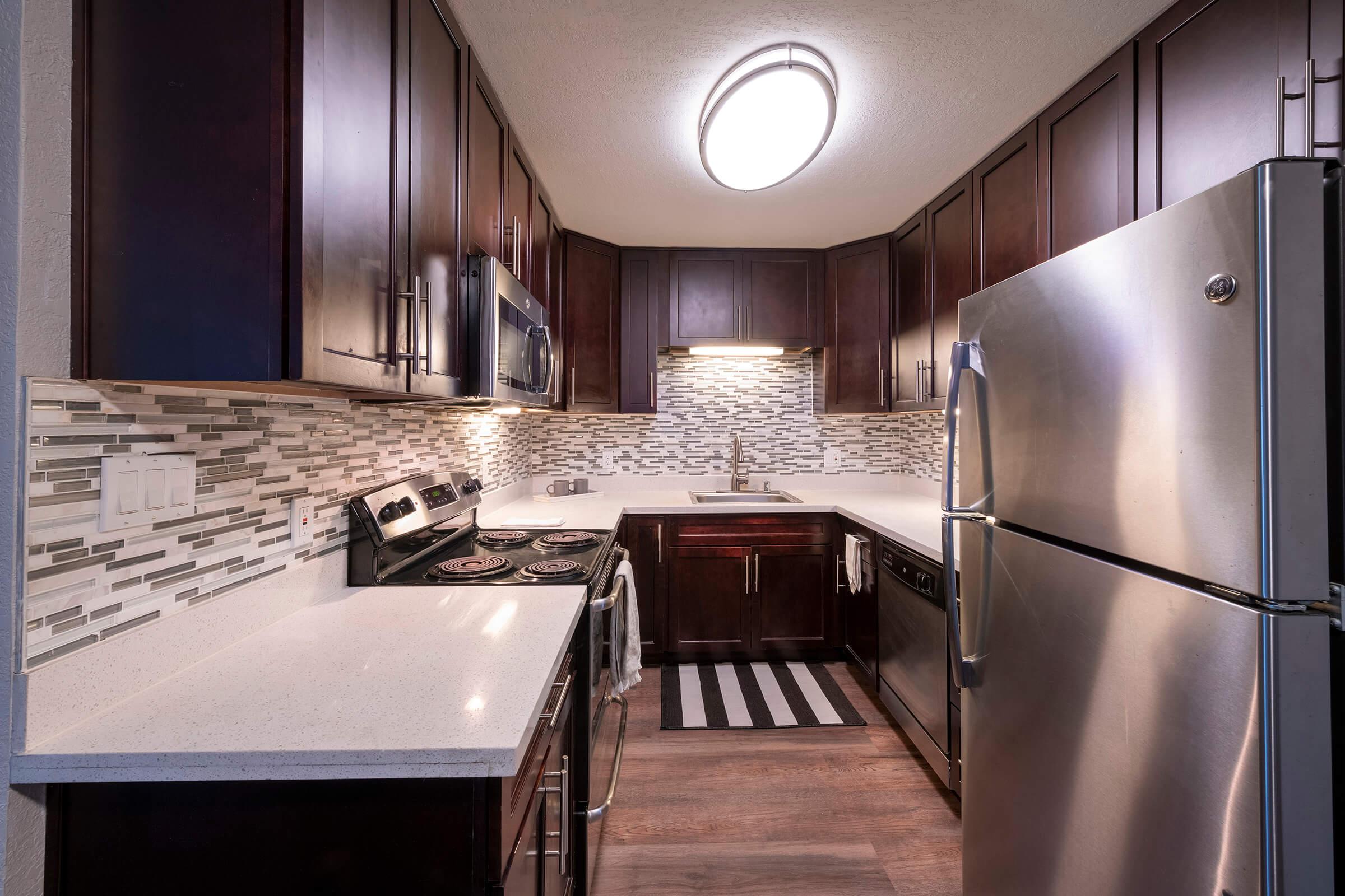 a modern kitchen with stainless steel appliances