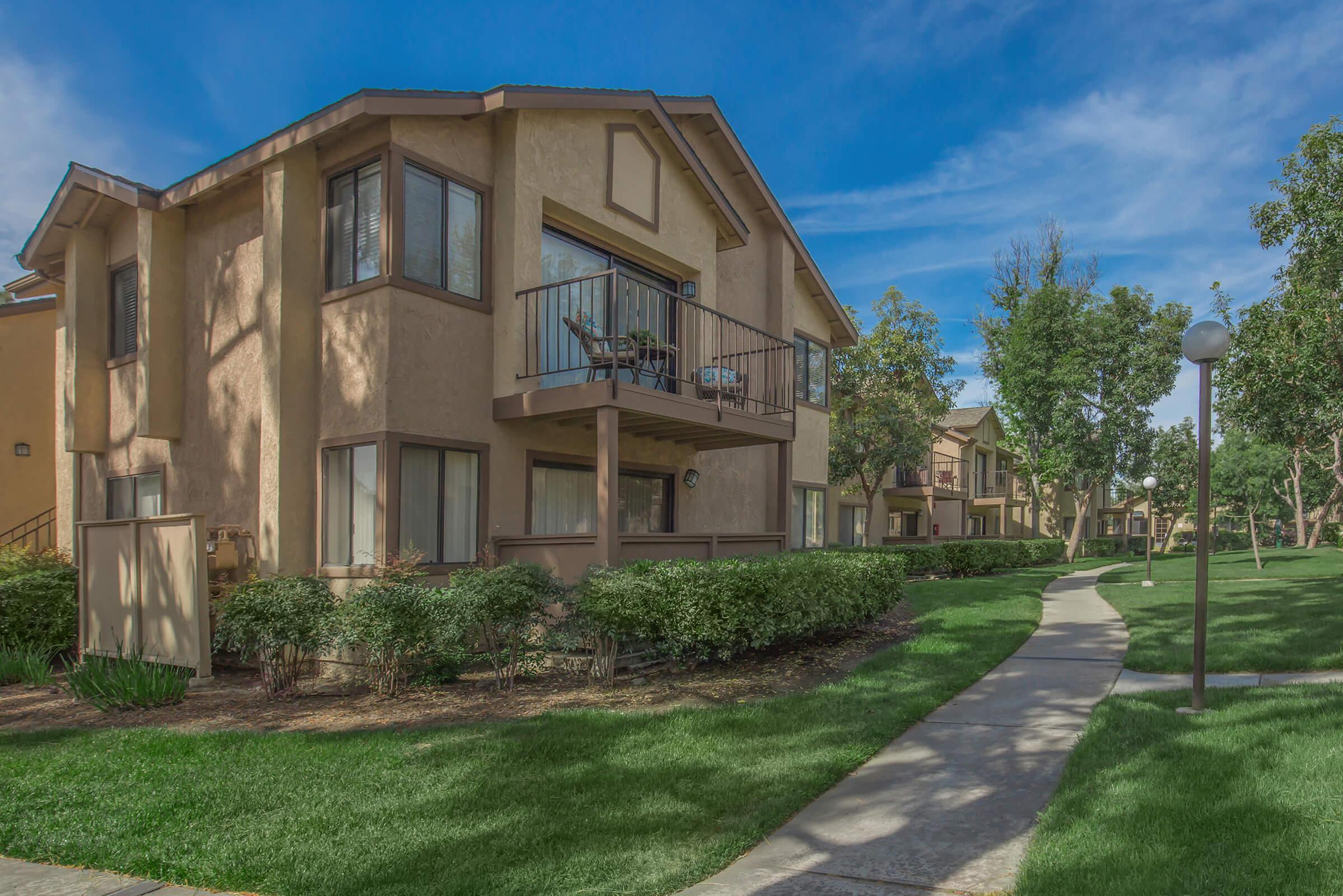 Mountain Springs Apartment Homes community buildings with green trees