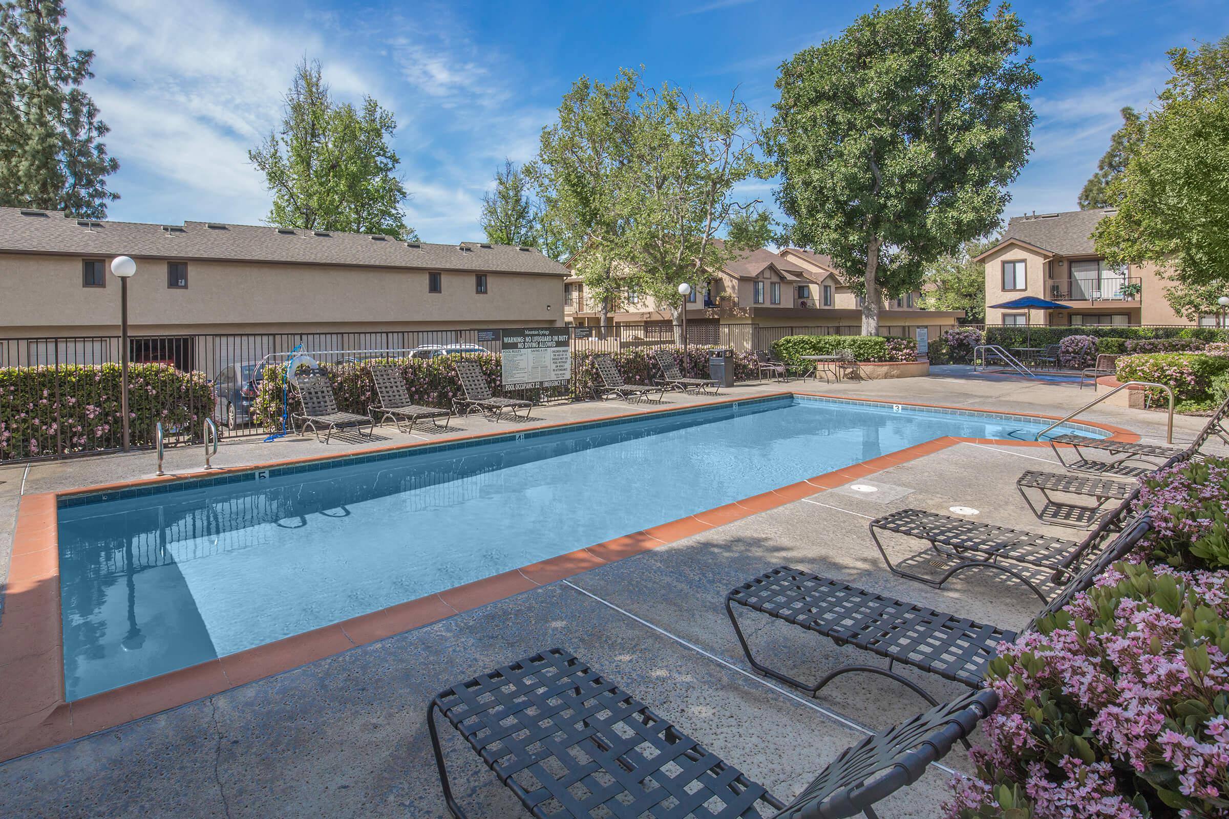 The community pool with rows of chairs