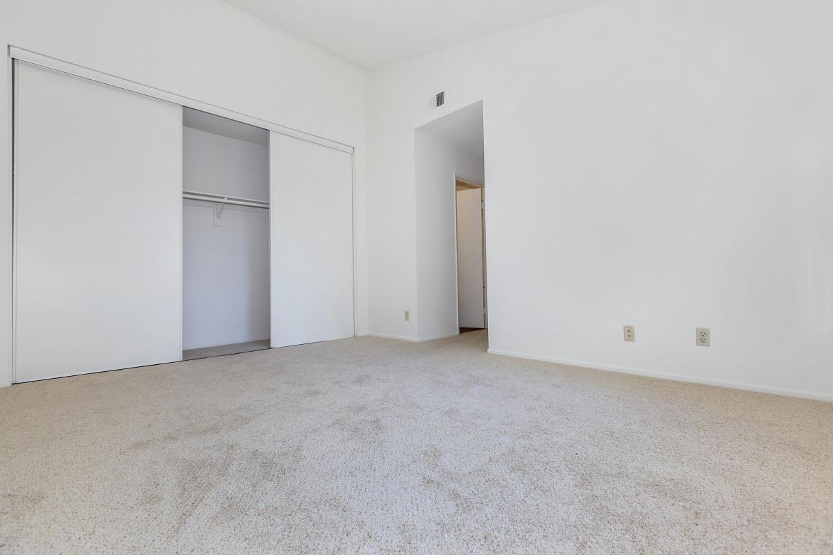 Bedroom with open sliding closet door