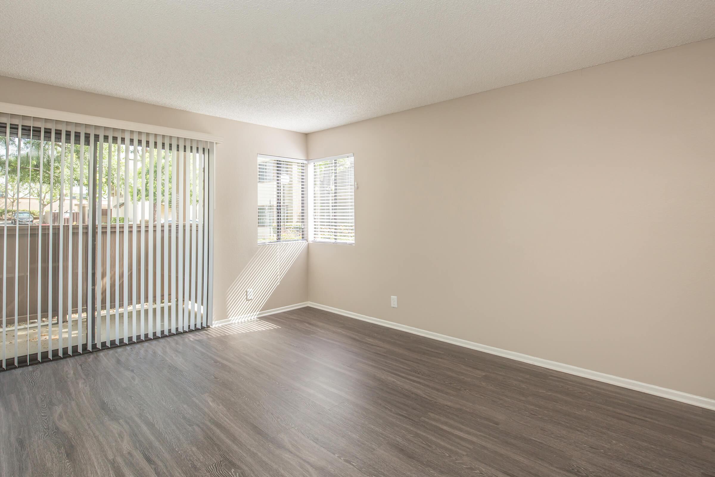 Unfurnished living room with glass sliding doors to patio