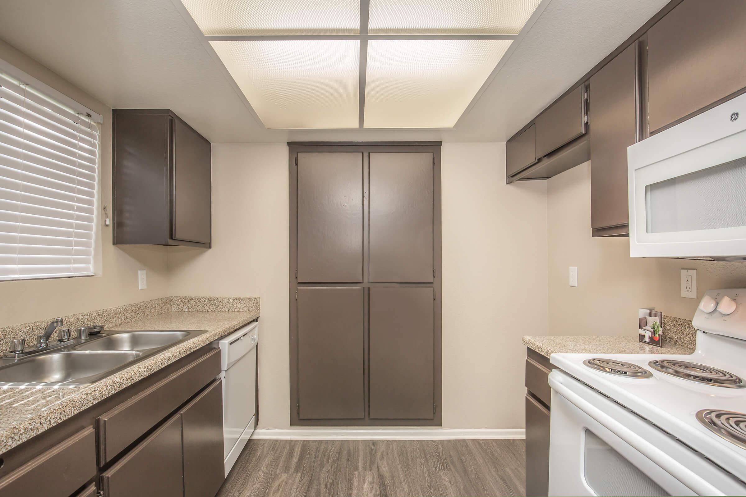 Kitchen with brown cabinets