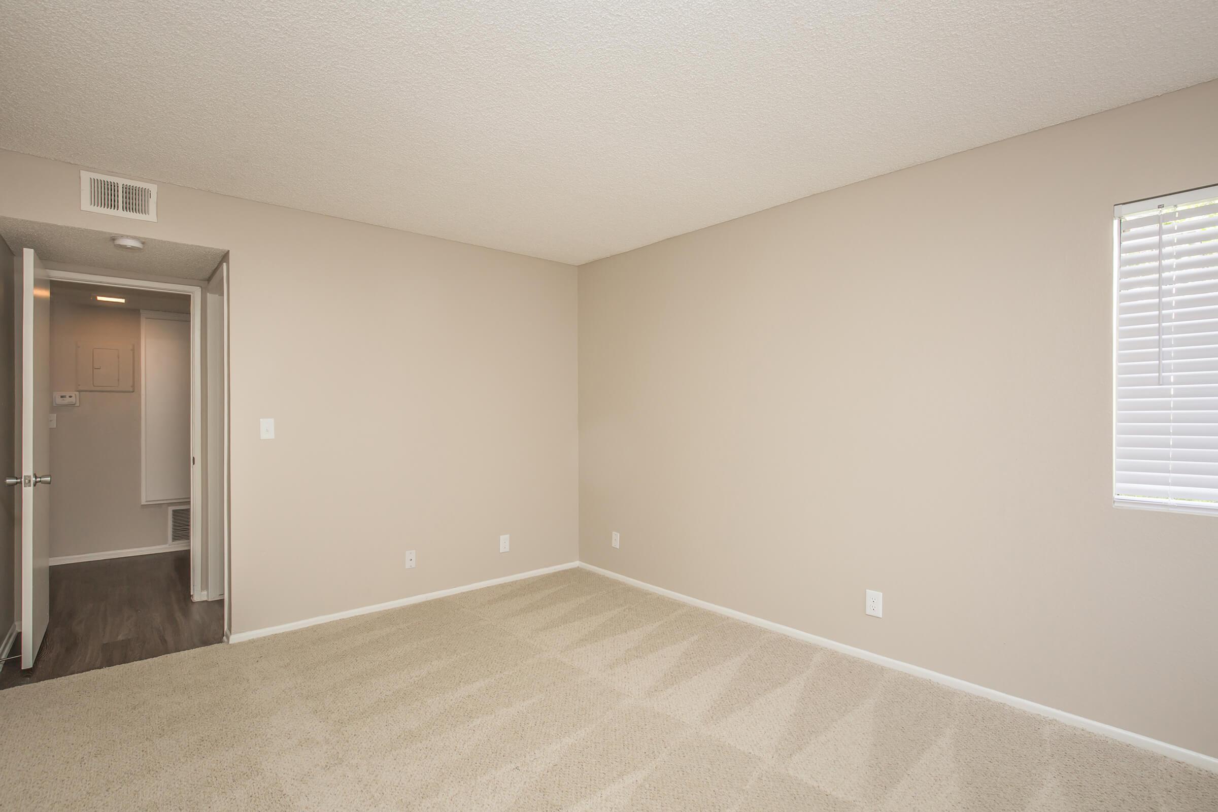 Unfurnished bedroom with carpet