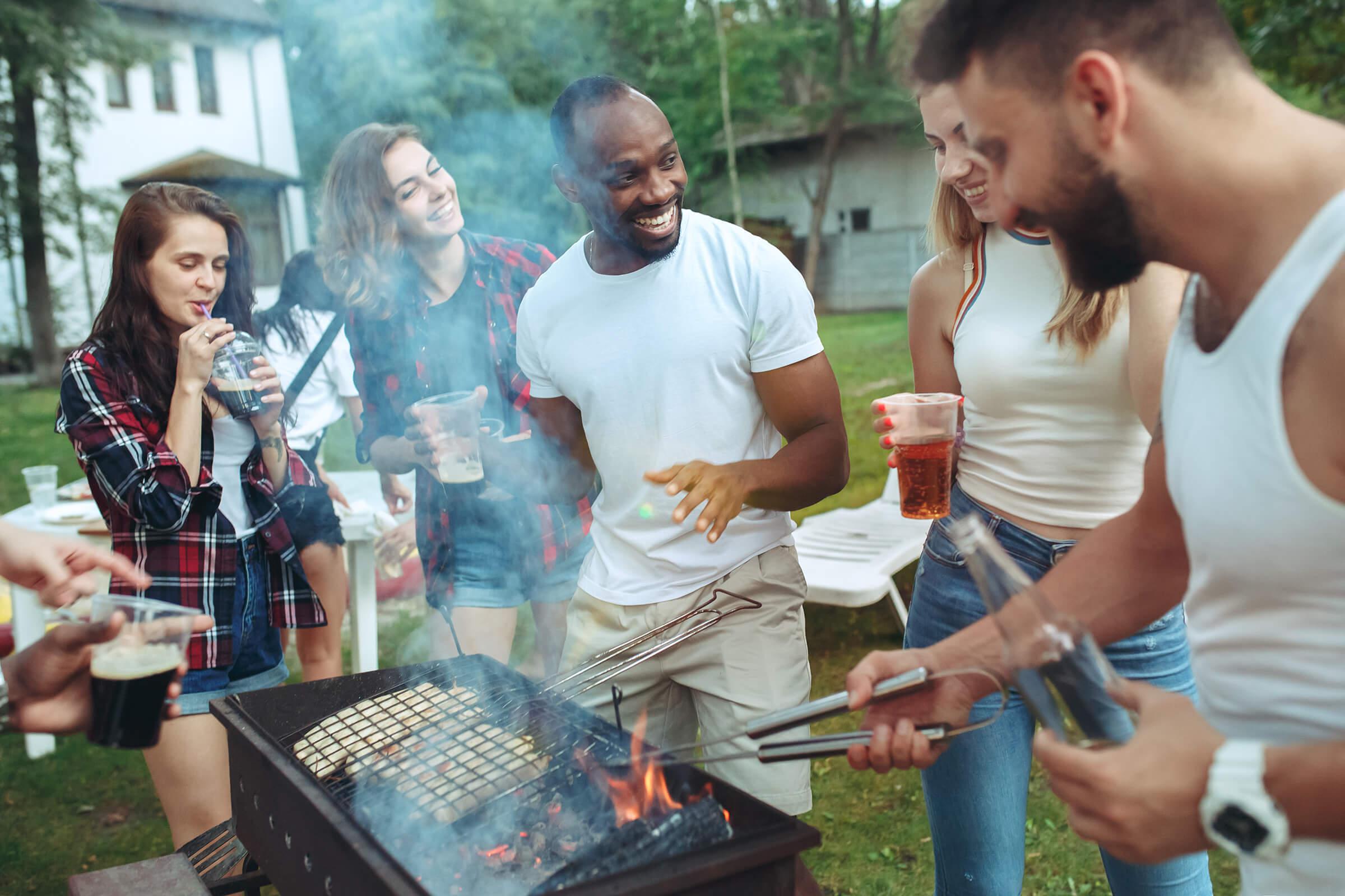 a group of people standing around a table