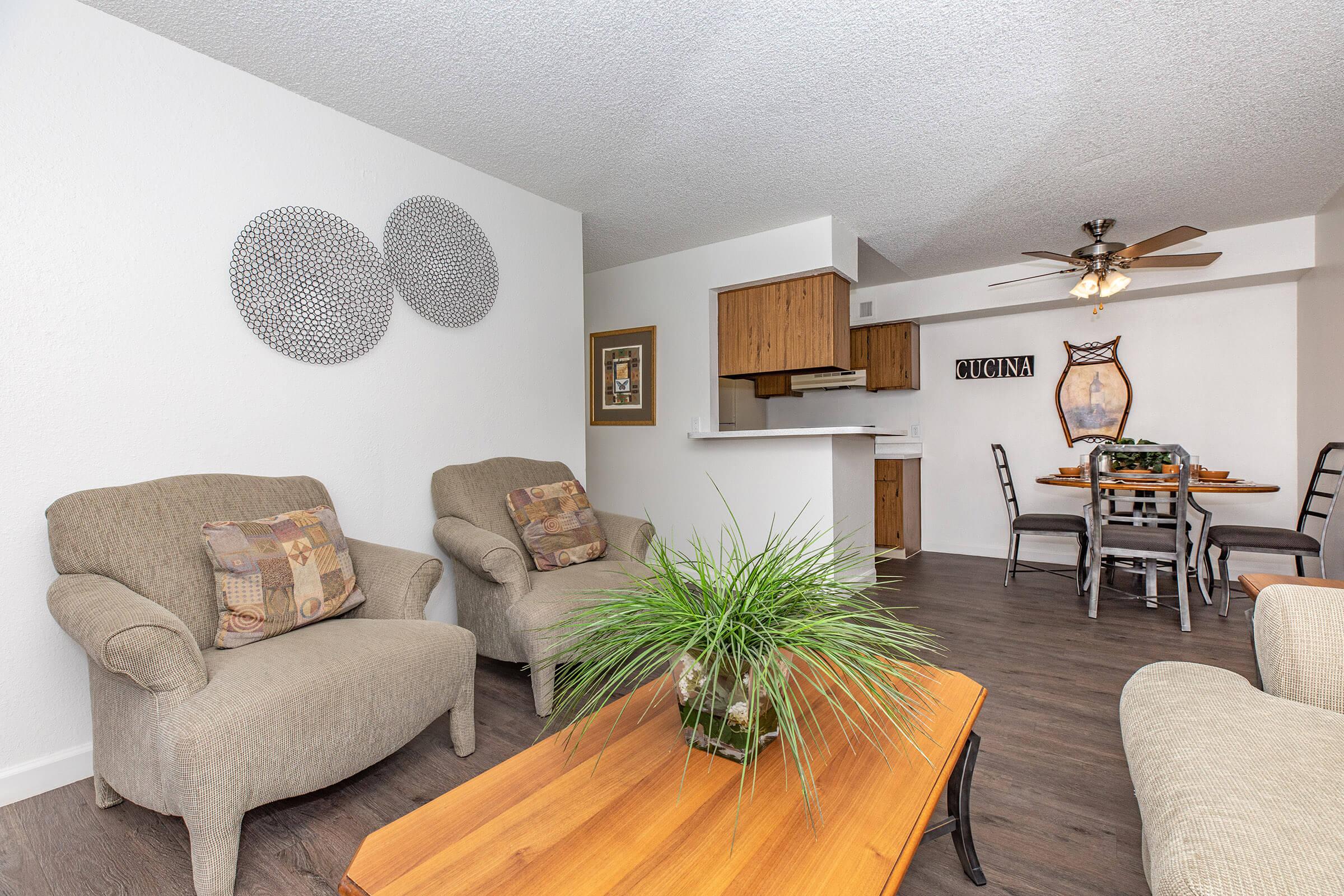 a living room filled with furniture and a table