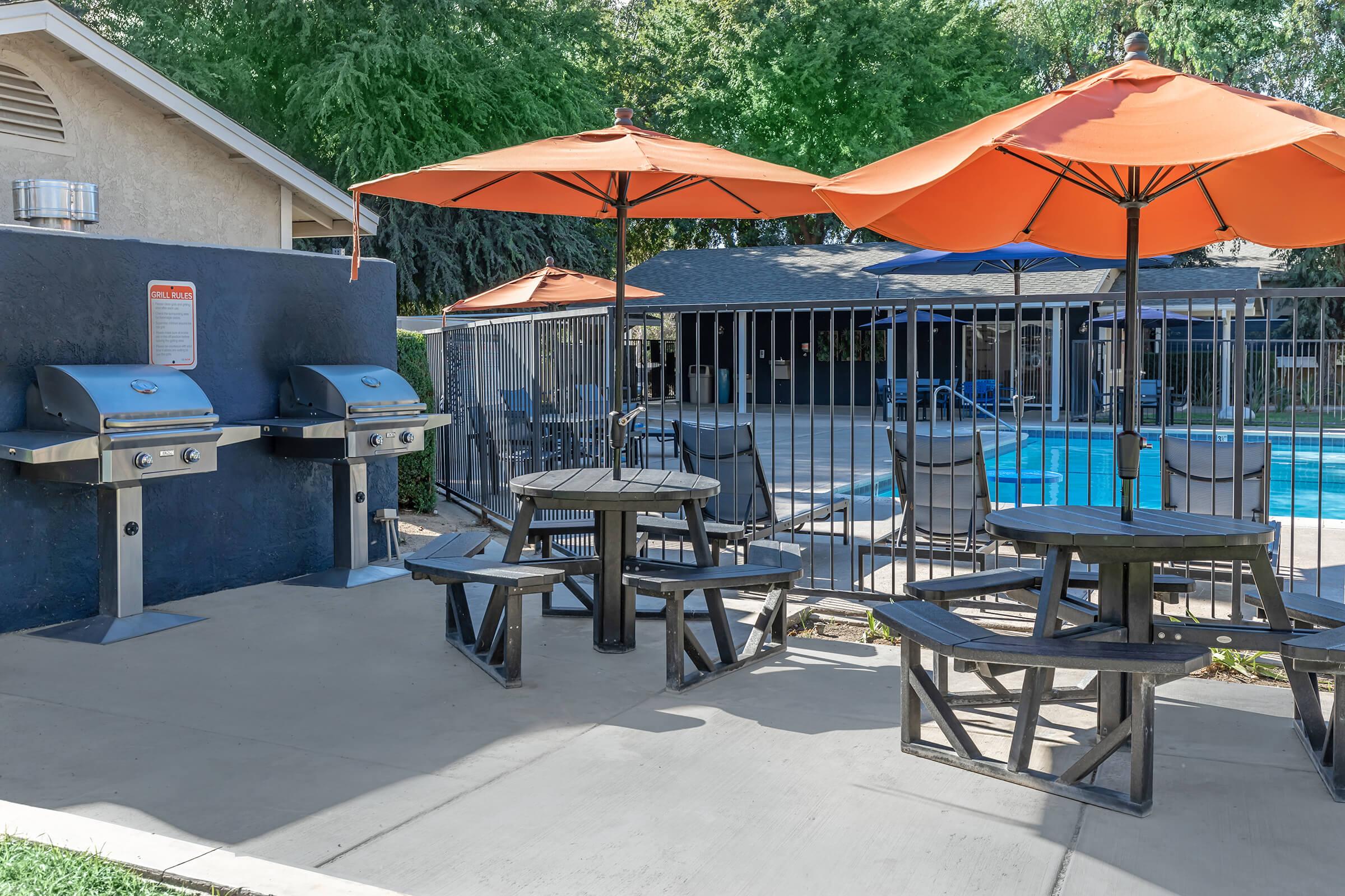 a group of lawn chairs sitting on top of a picnic table