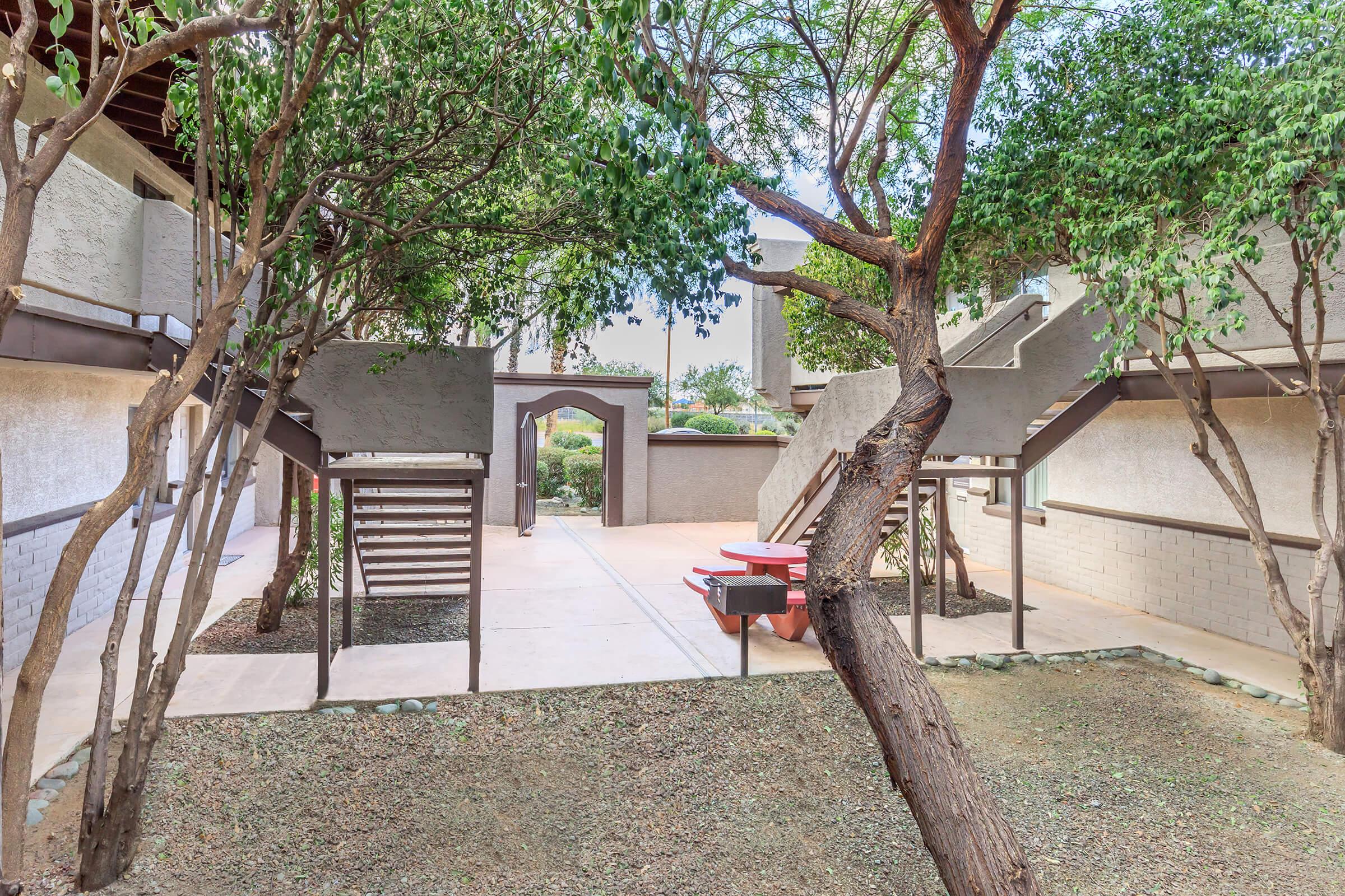 a tree in front of a house