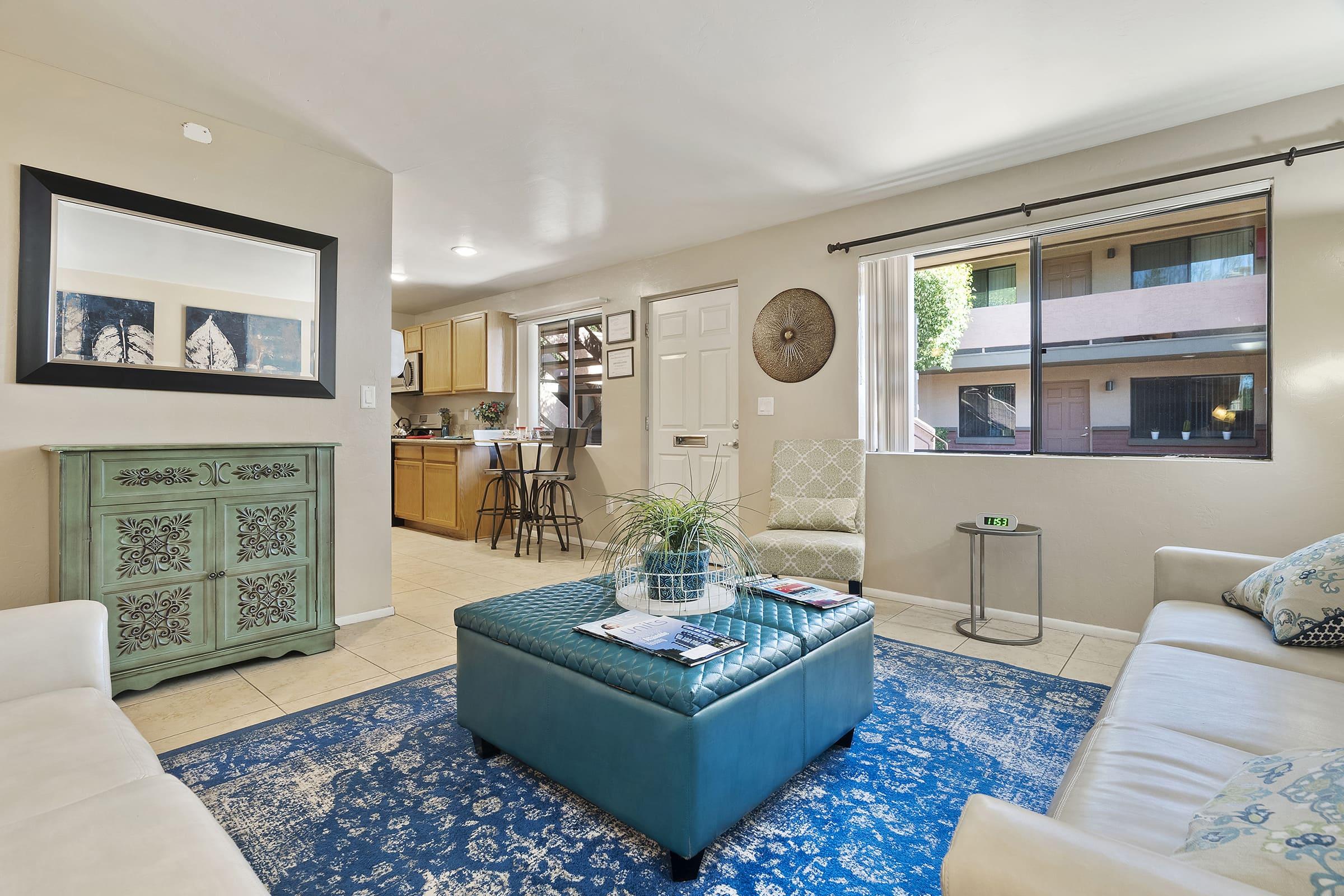 a living room with blue walls and a large window