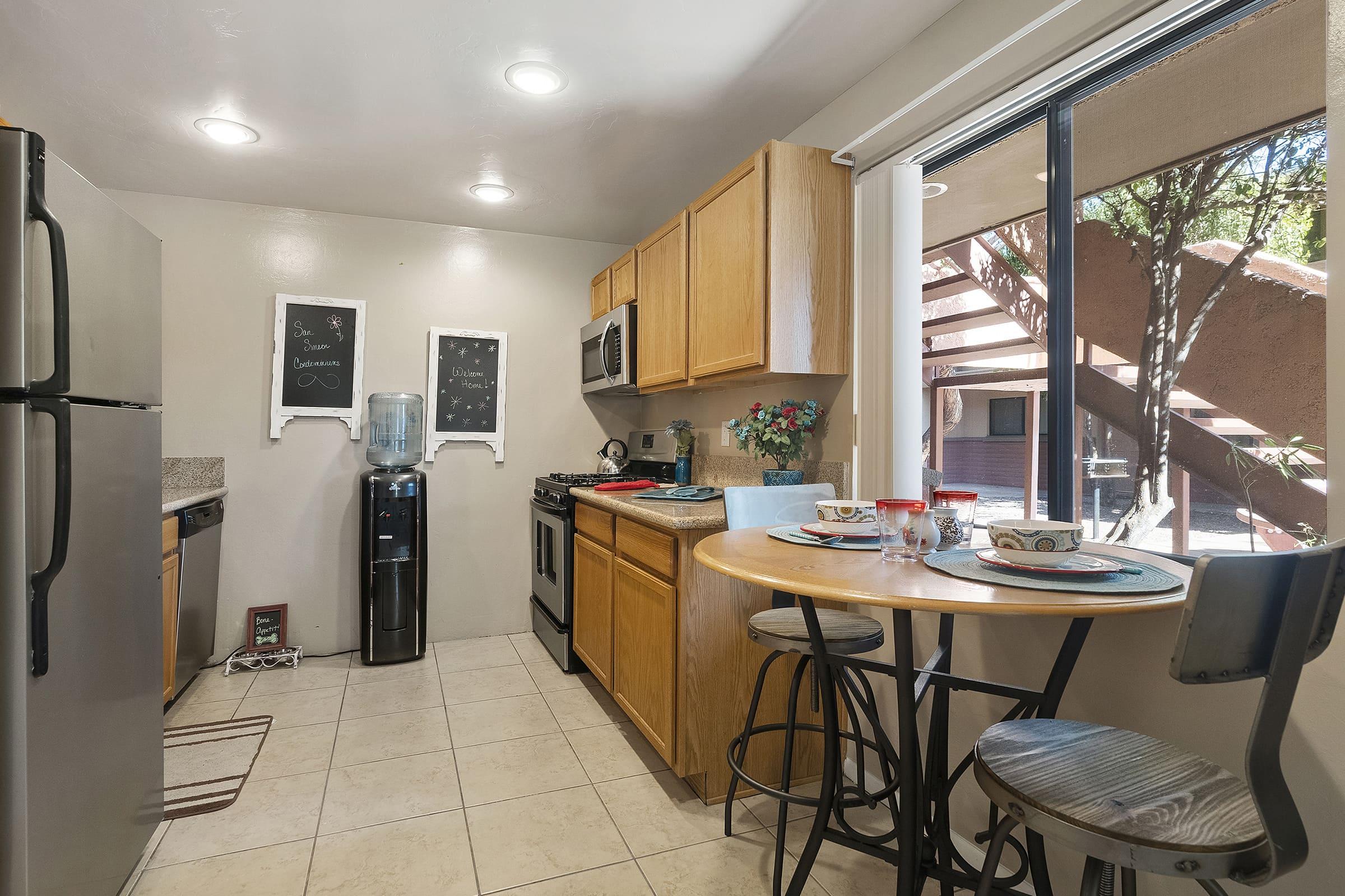 a kitchen with a table in a room