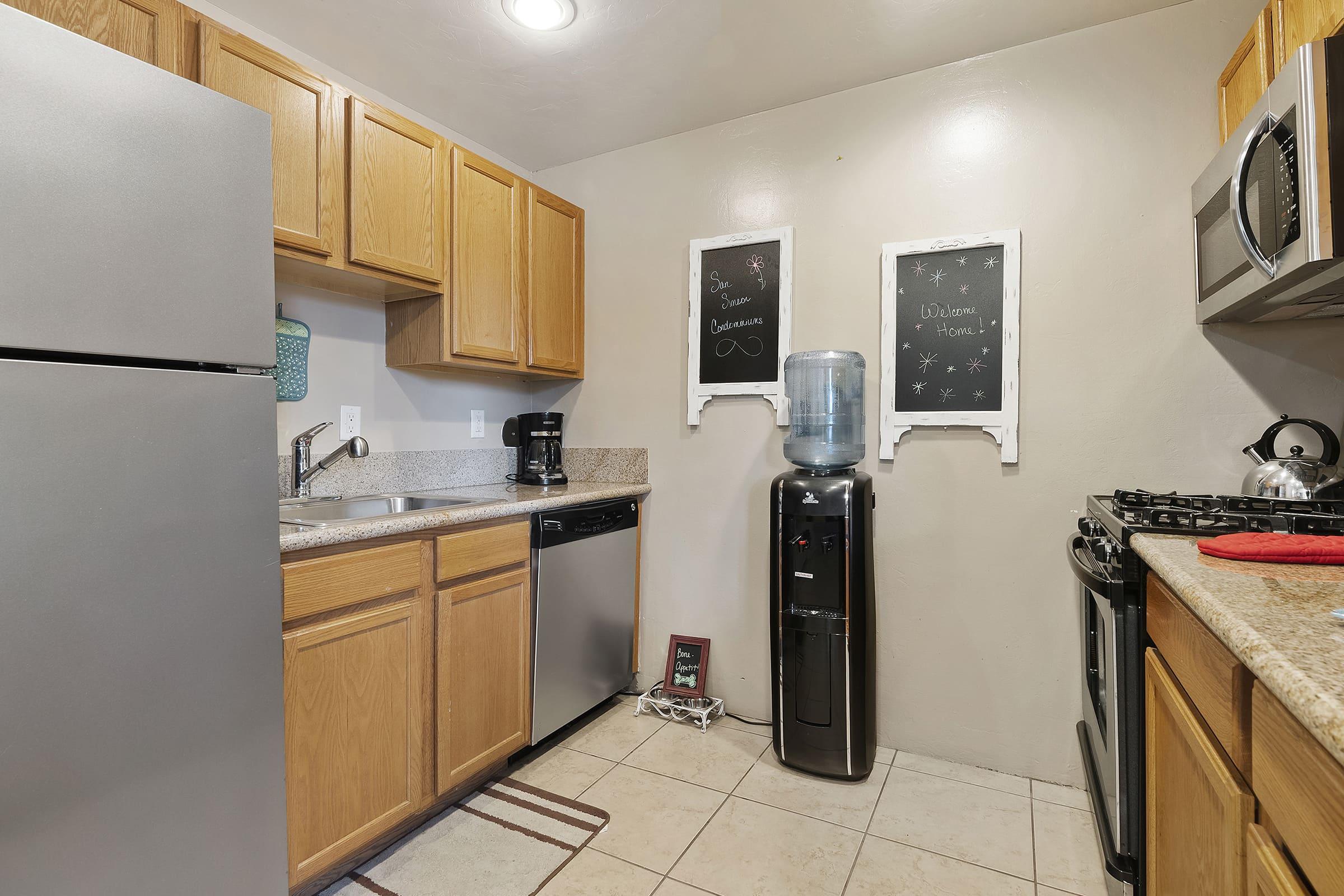 a kitchen with a stove and a refrigerator