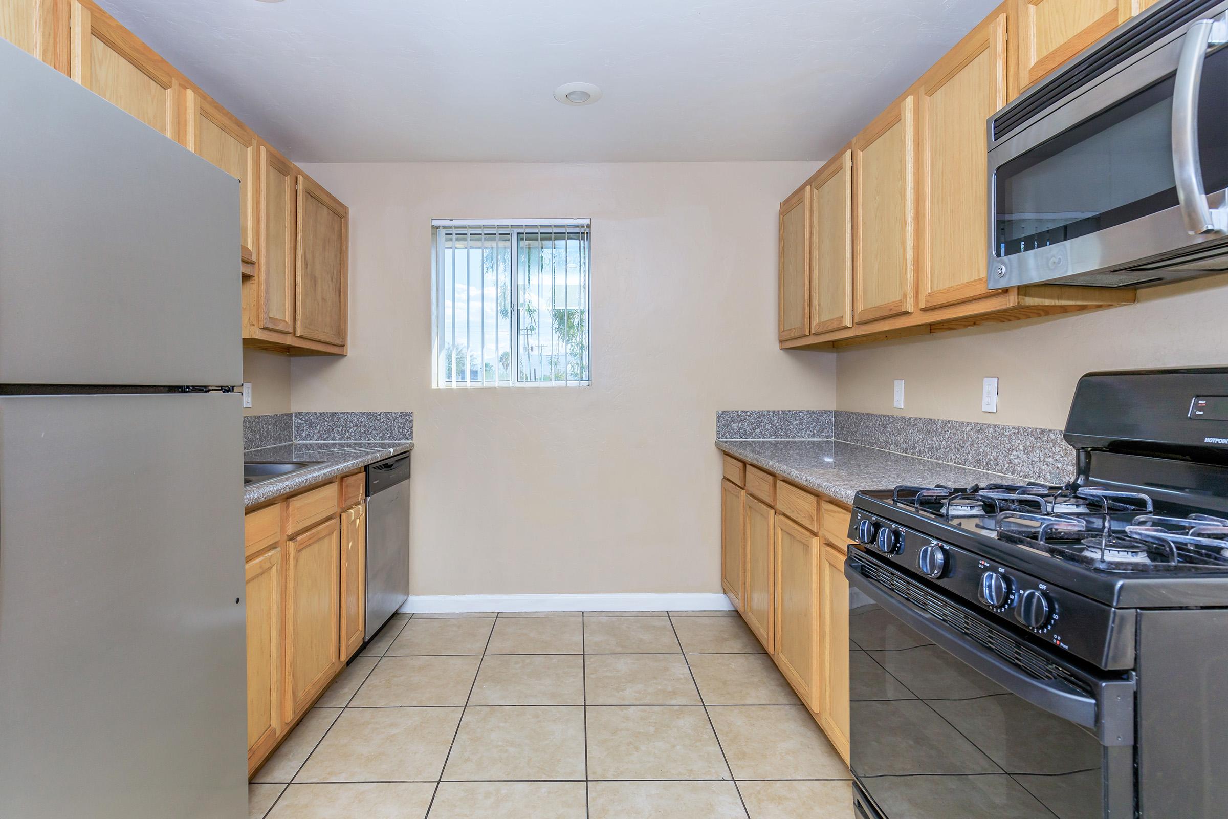 a kitchen with a stove top oven