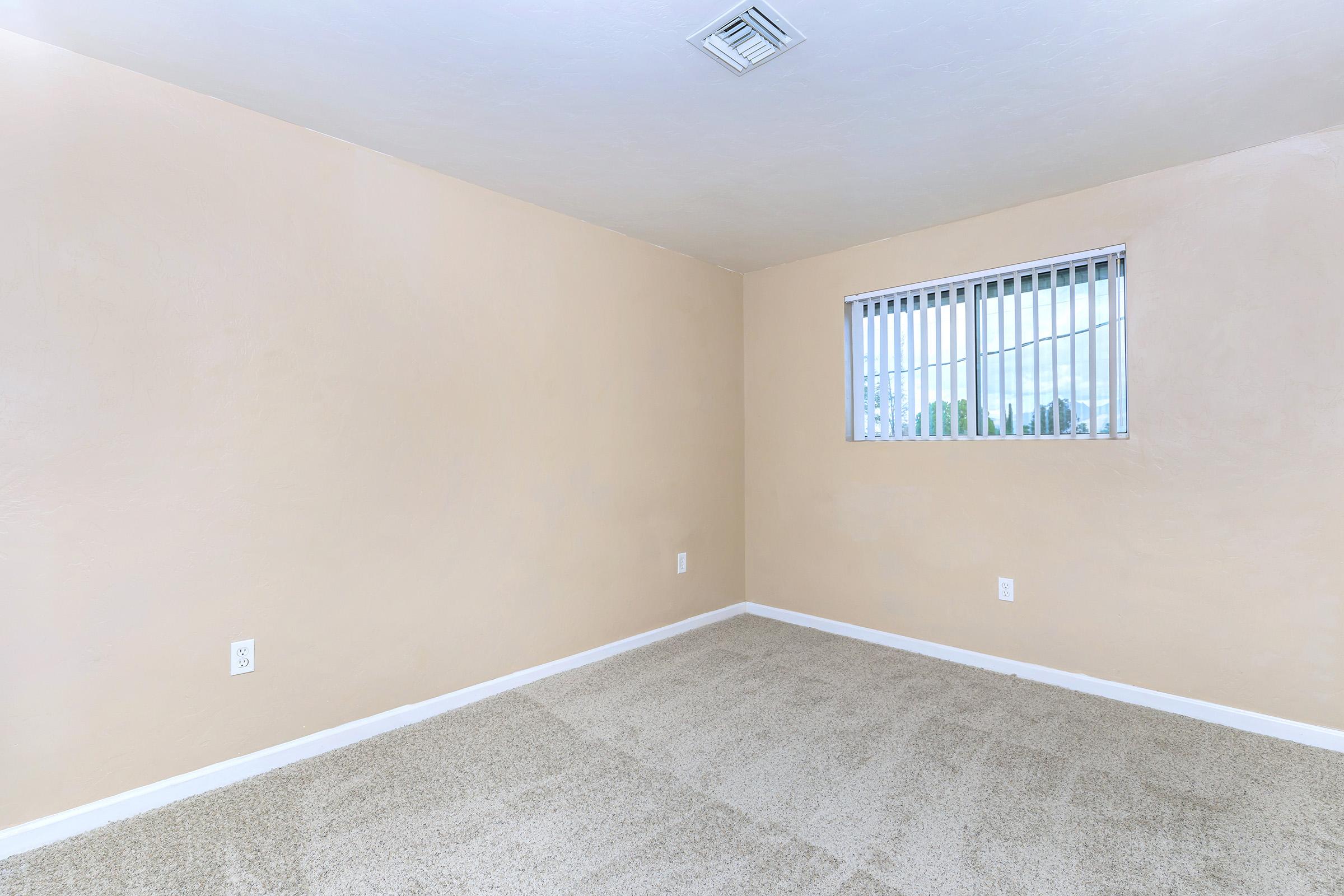 a bedroom with a large window